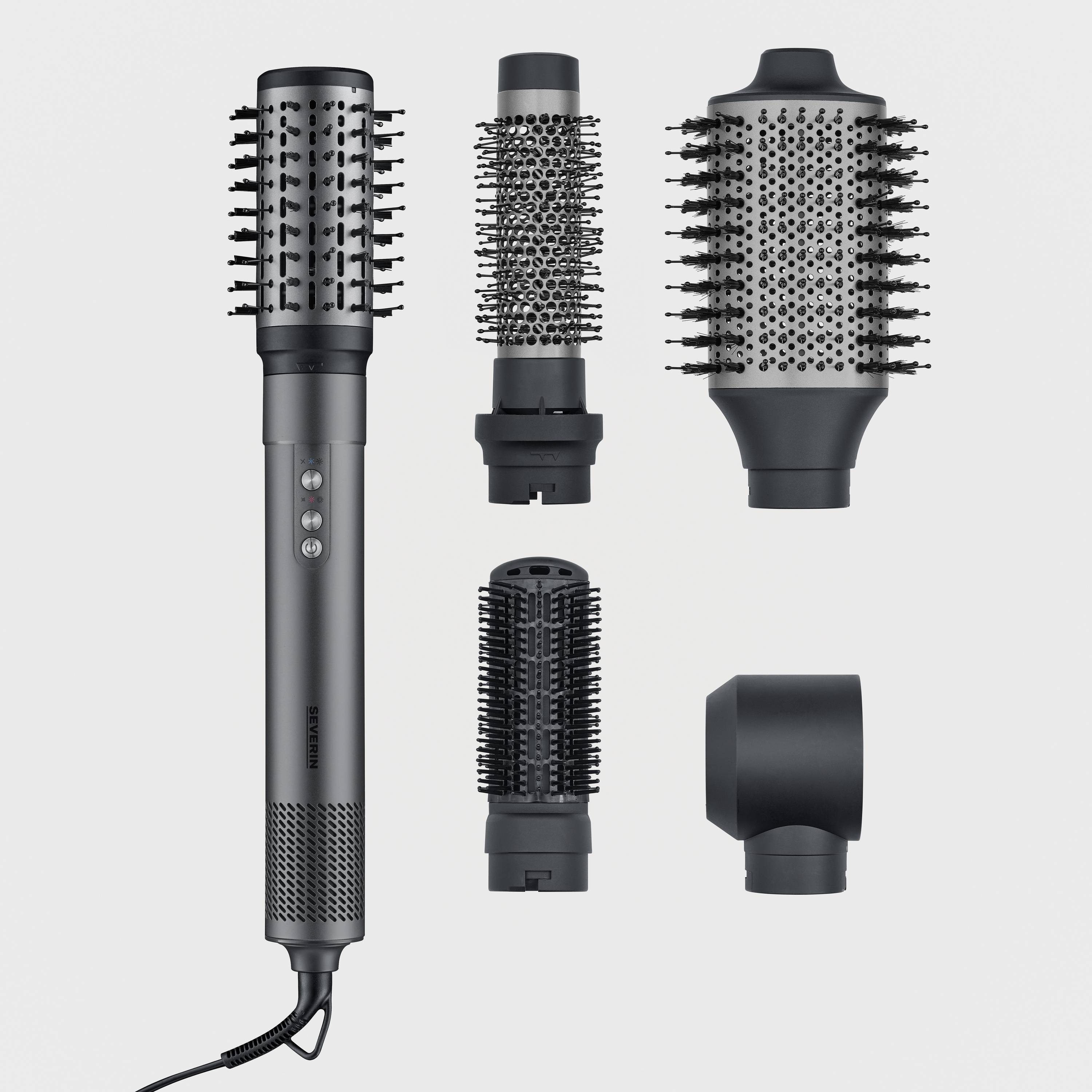 Elektryczna suszarka do włosów z czterema wymiennymi końcówkami do stylizacji: szczotka okrągła, mniejsza szczotka okrągła, szeroki grzebień oraz nasadka do nadmuchu.