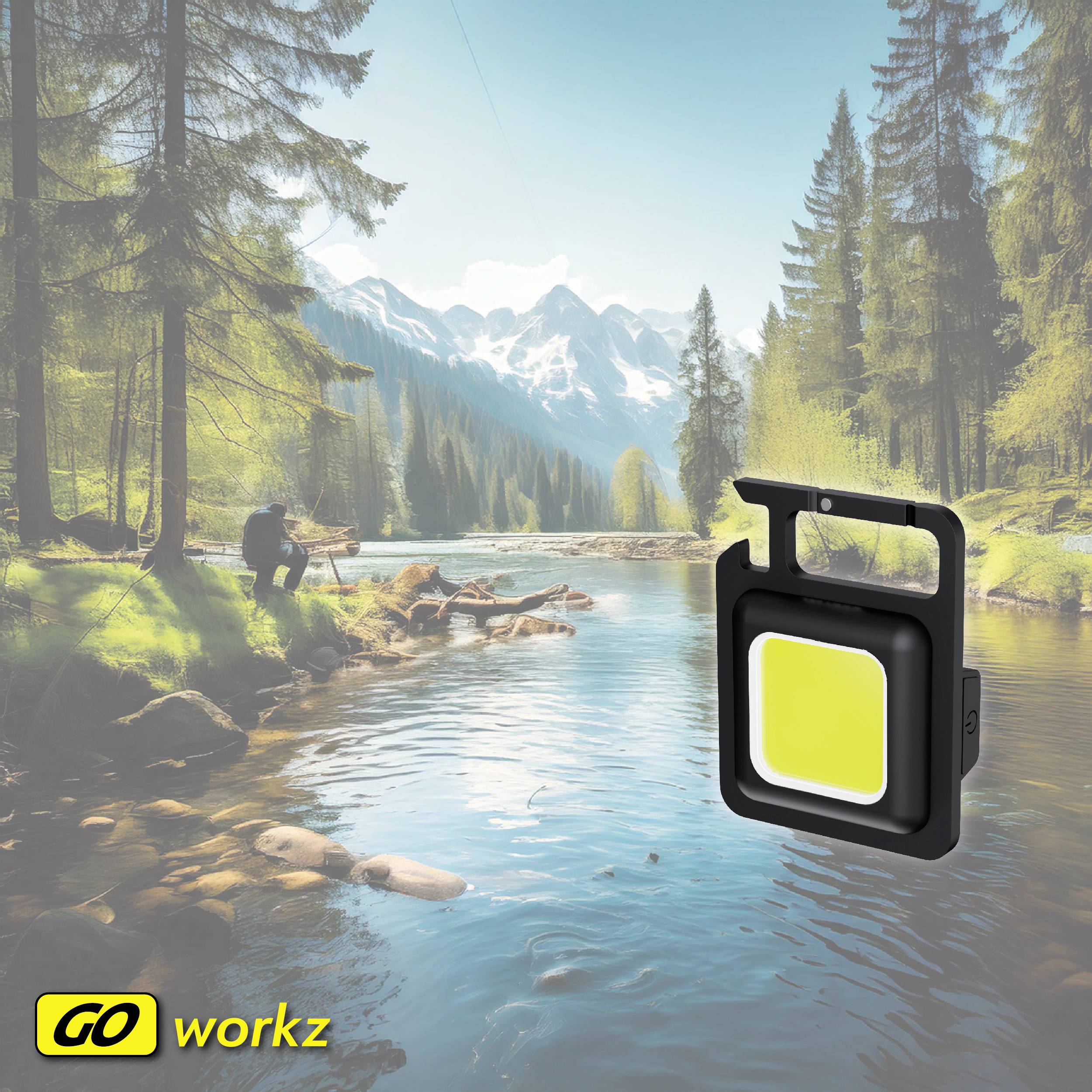 Naturalna scena z spokojnym jeziorem i górami w tle. Na pierwszym planie przenośna, jaskrawo żółta lampa unosząca się po prawej stronie.