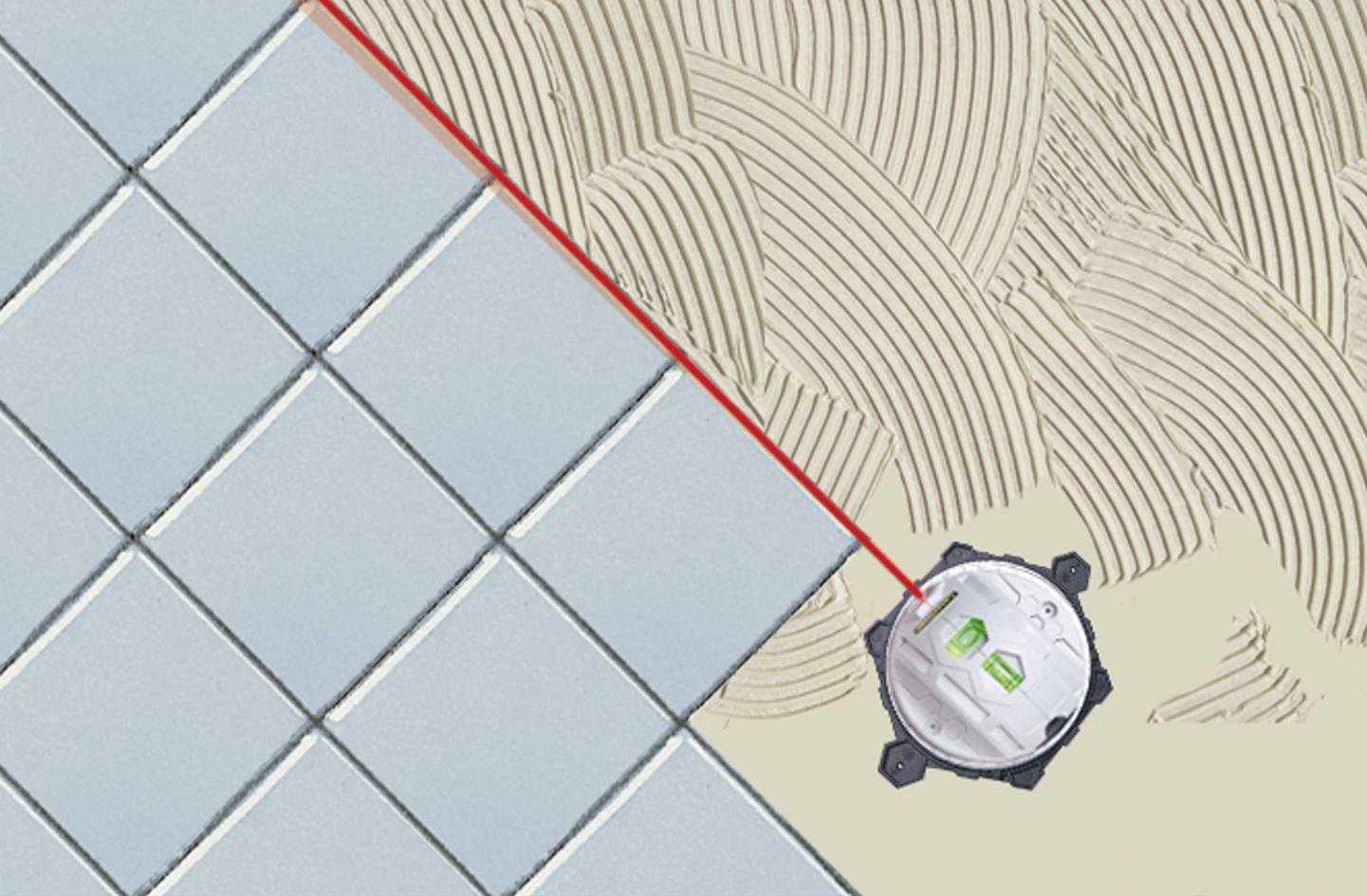 Kafelkarz używa laserowego urządzenia do poziomowania podczas precyzyjnego układania płytek. Czerwona linia lasera wskazuje dokładne wyrównanie.