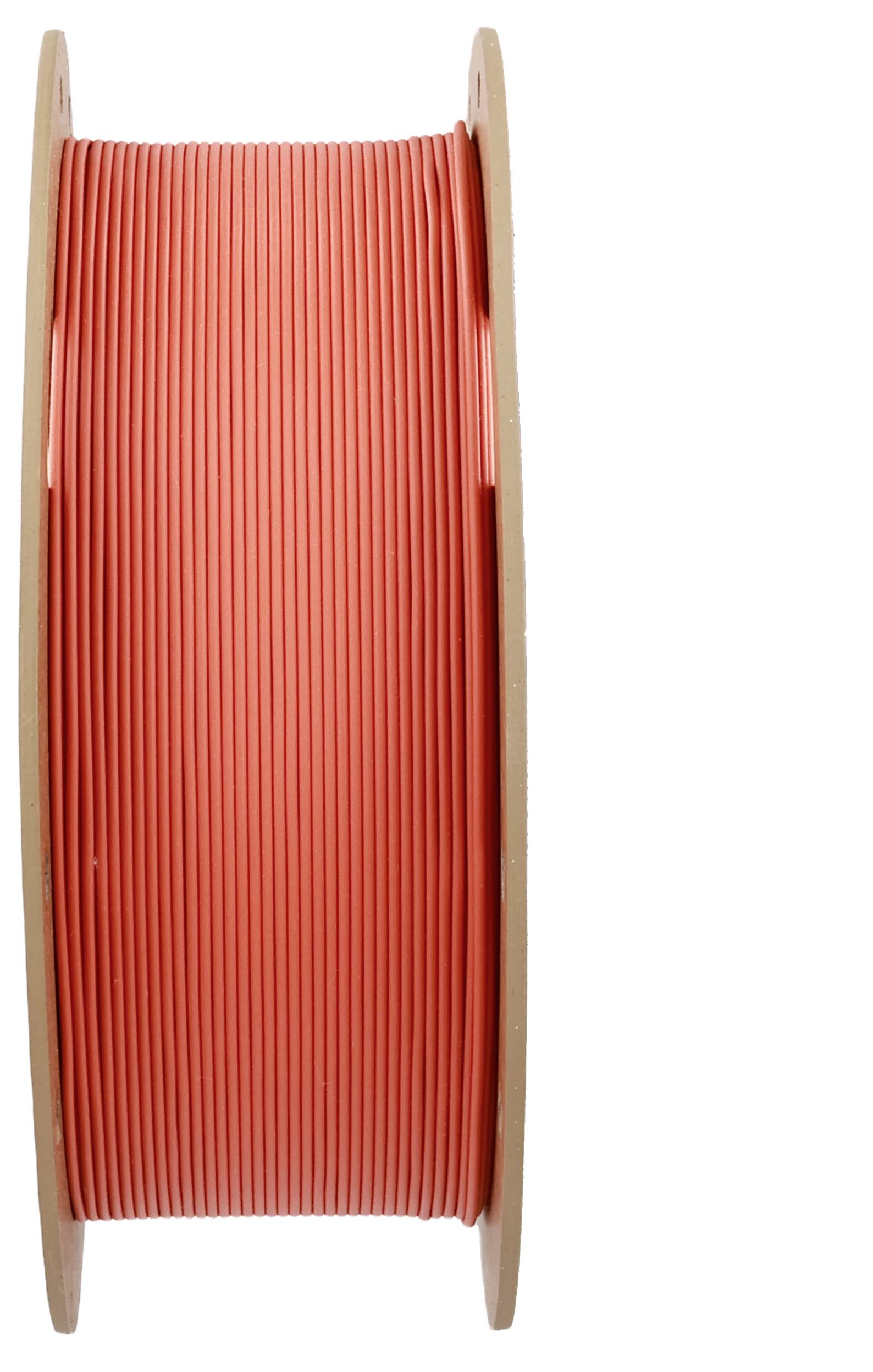 Szpula z czerwonym drutem z tworzywa sztucznego, nawinięta między dwoma okrągłymi drewnianymi krążkami.