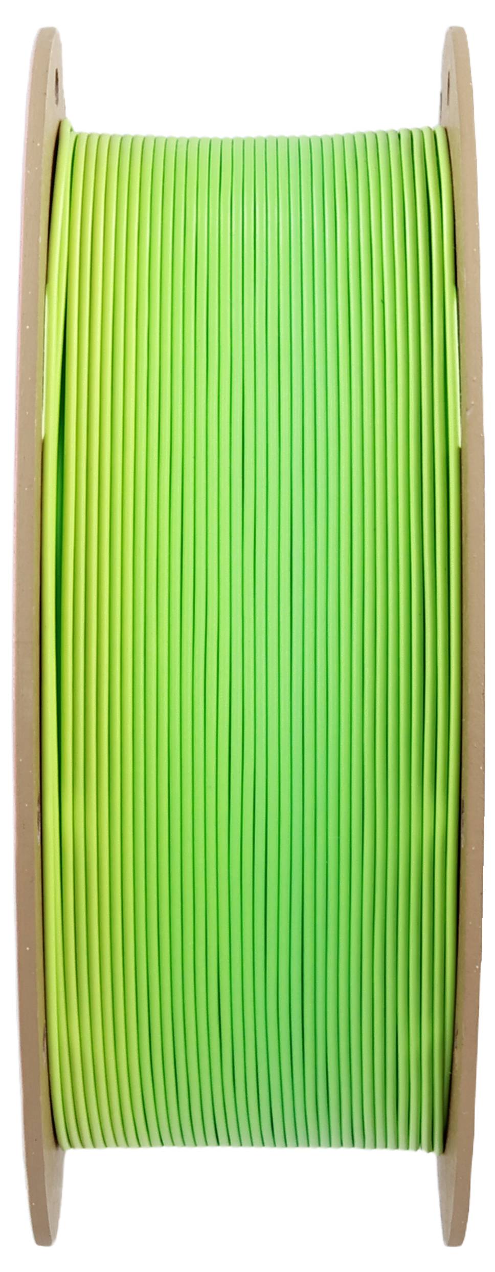 Zielona szpula filamentu, stojąca pionowo, do drukarki 3D.