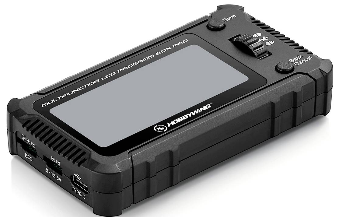 Czarna skrzynka programująca LCD z wieloma przyciskami z boku, z napisem 'Multifunction LCD Program Box Pro'. Przeznaczona głównie dla hobbystów elektroniki.