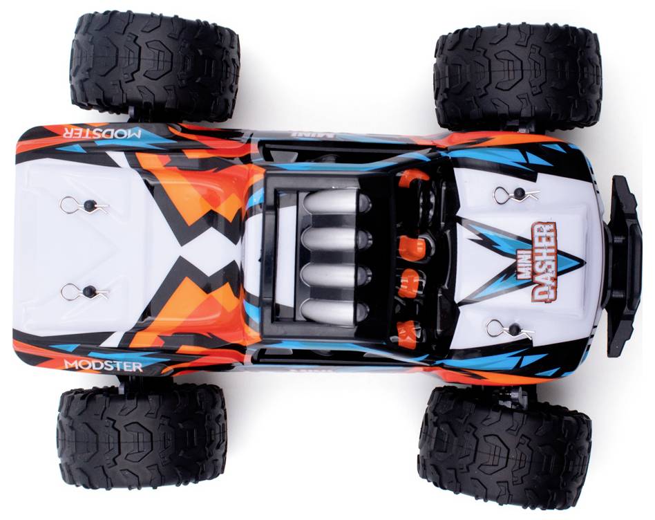 Zabawkowy samochód widziany z lotu ptaka, z świecącym designem w kolorach pomarańczowym, białym i czarnym. Duże, masywne koła do jazdy w terenie.