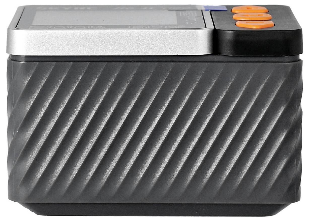 Przenośne, prostokątne, cylindryczne urządzenie z rowkami po bokach i pomarańczowymi przyciskami na górze.