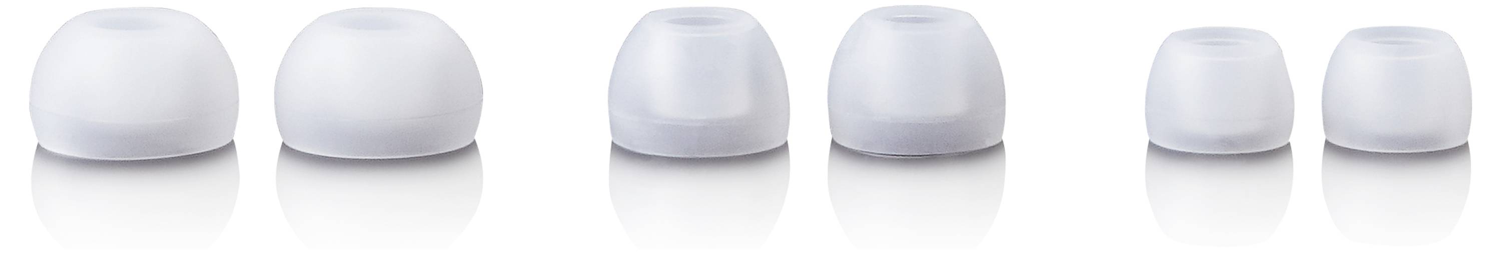 Różne rozmiary białych zatyczek do uszu z silikonu ułożone w rzędzie.