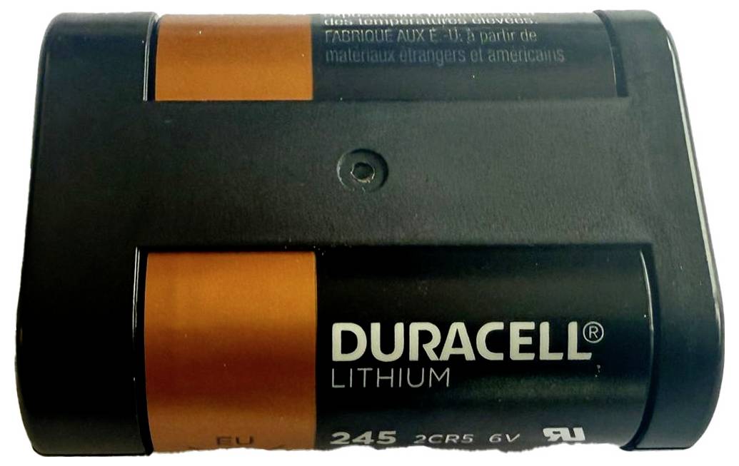 Czarna i pomarańczowa bateria litowa Duracell z napisem 'Duracell Lithium' na przedniej stronie, przeznaczona do urządzeń 6V.