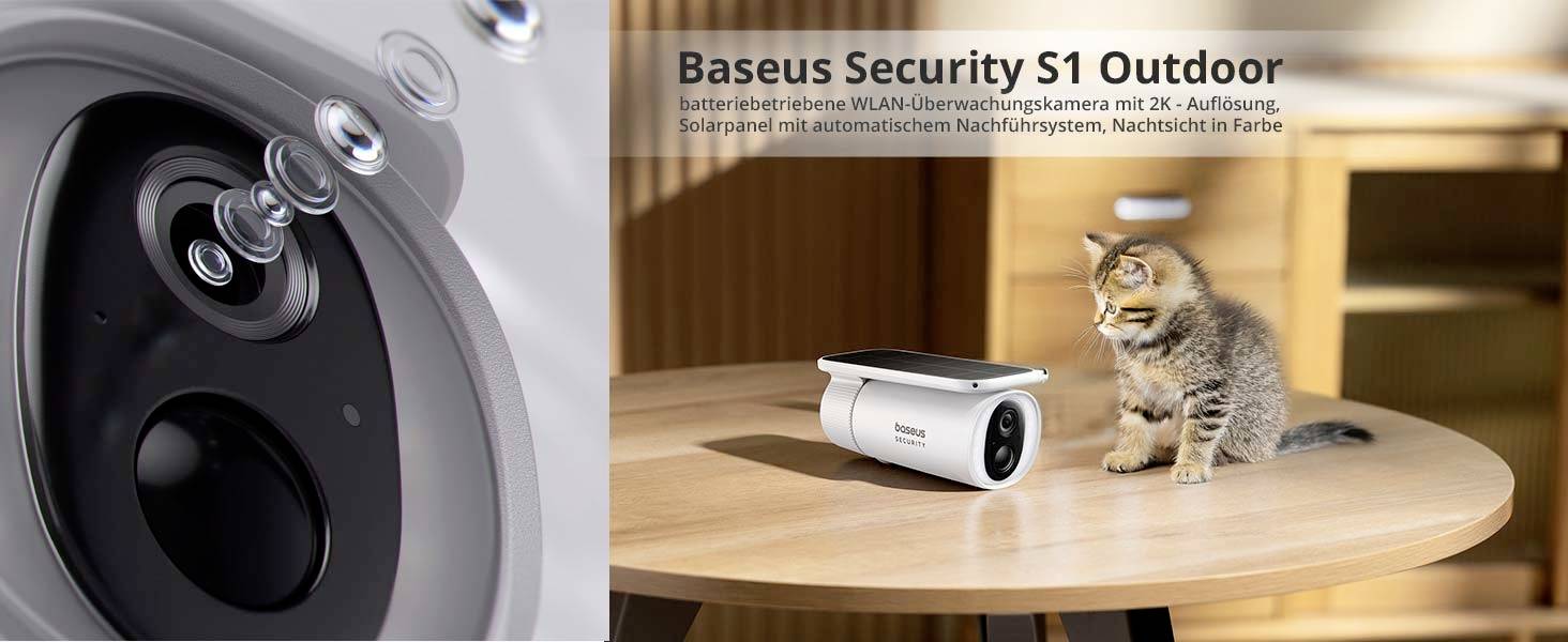 Kamera monitorująca na stole z kotkiem, reklamowana jako 'Baseus Security S1 Outdoor', zasilana bateryjnie z panelem słonecznym i funkcją nocnego widzenia.