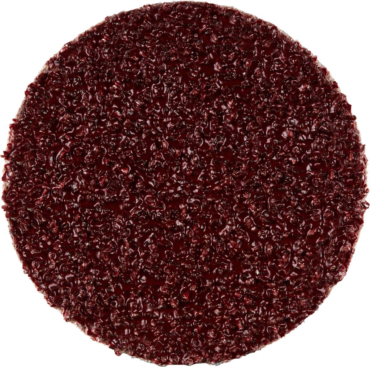 Okrągła, błyszcząca, głęboko czerwona powierzchnia owocu, prawdopodobnie wykonana z galaretki lub dżemu.