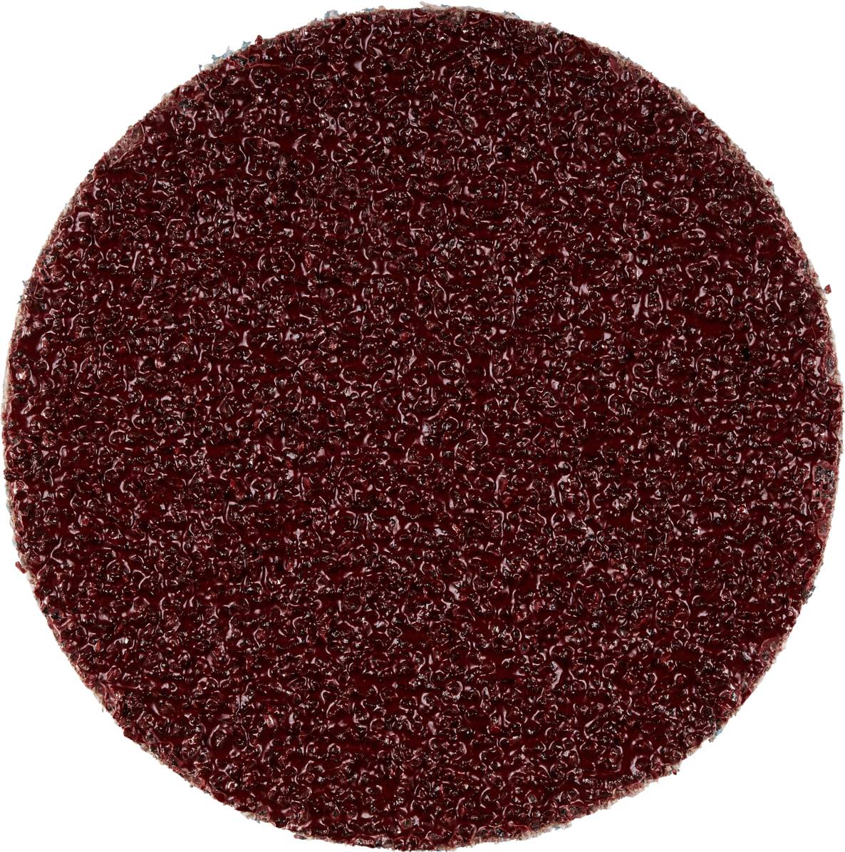 Czerwony, okrągły papier ścierny o szorstkiej powierzchni, odpowiedni do szlifowania drewna lub metalu.