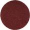 Okrągły, czerwony papier ścierny o grubym ziarnie, używany do prac szlifierskich.