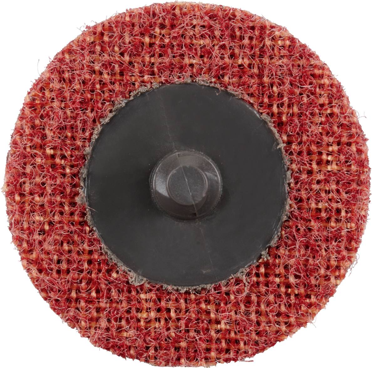 Okrągła, czerwona podkładka ścierna o szorstkiej strukturze, z centralnym czarnym elementem mocującym, używana do wygładzania powierzchni.