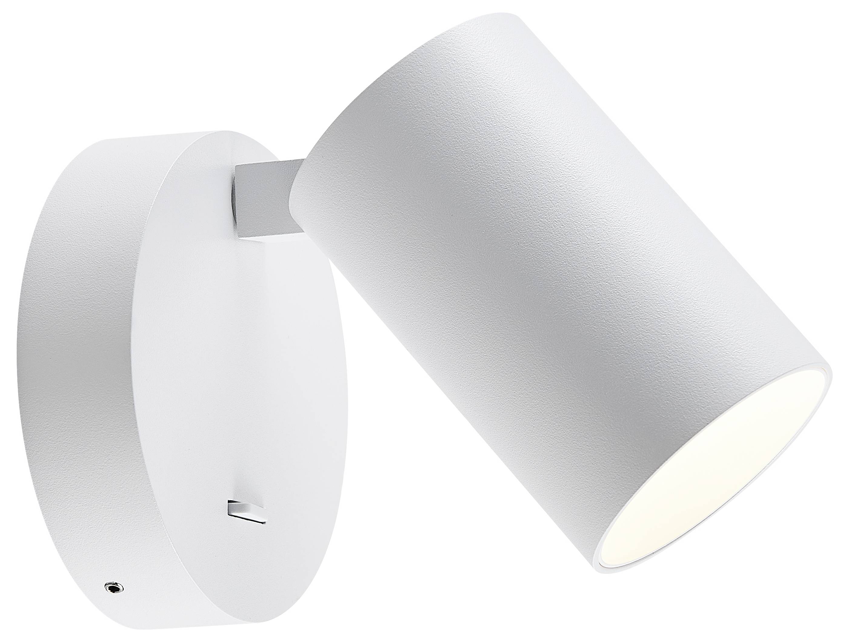 Biała lampa ścienna z okrągłą podstawą i cylindrycznym kloszem, lekko pochylona, rozpraszająca delikatne światło.