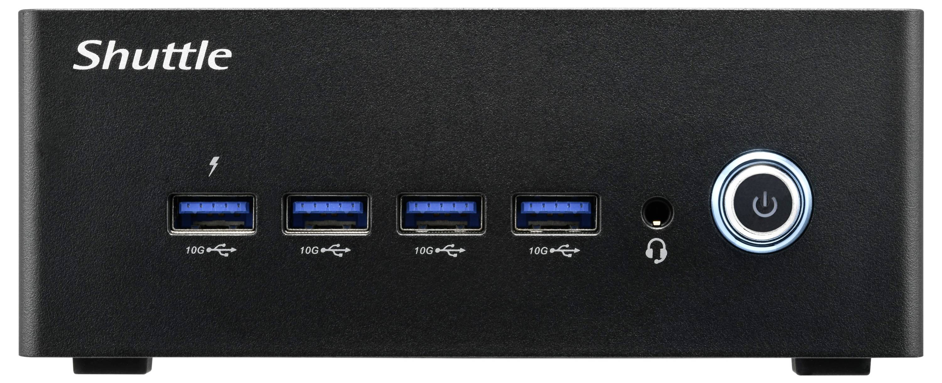 Czarny moduł komputerowy z napisem 'Shuttle' w lewym górnym rogu, cztery złącza USB pośrodku oraz włącznik sieciowy po prawej stronie.