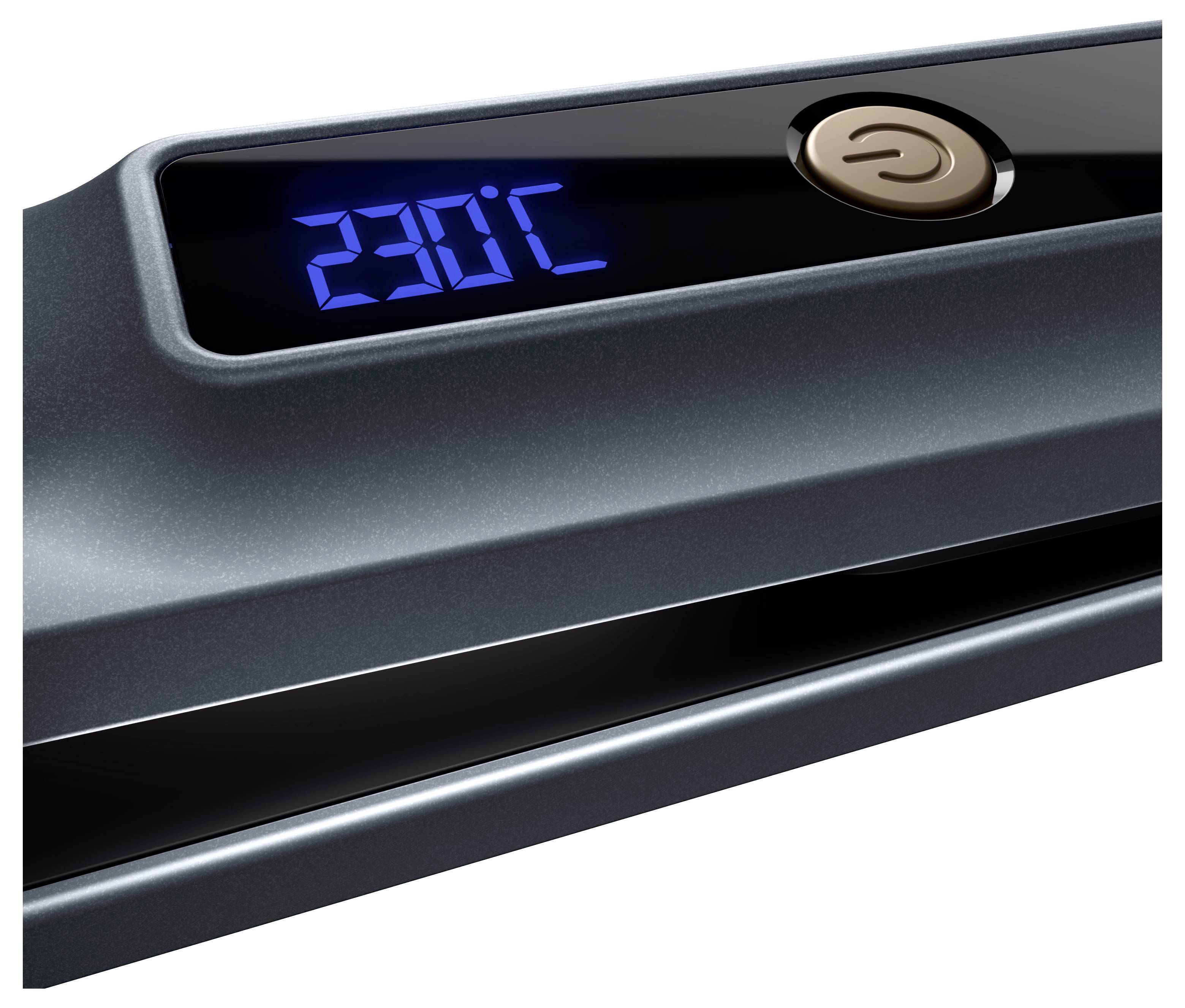 Szara prostownica do włosów z wyświetlaczem cyfrowym wskazuje temperaturę 230 stopni Celsjusza. Na górze znajduje się przełącznik włączania/wyłączania.