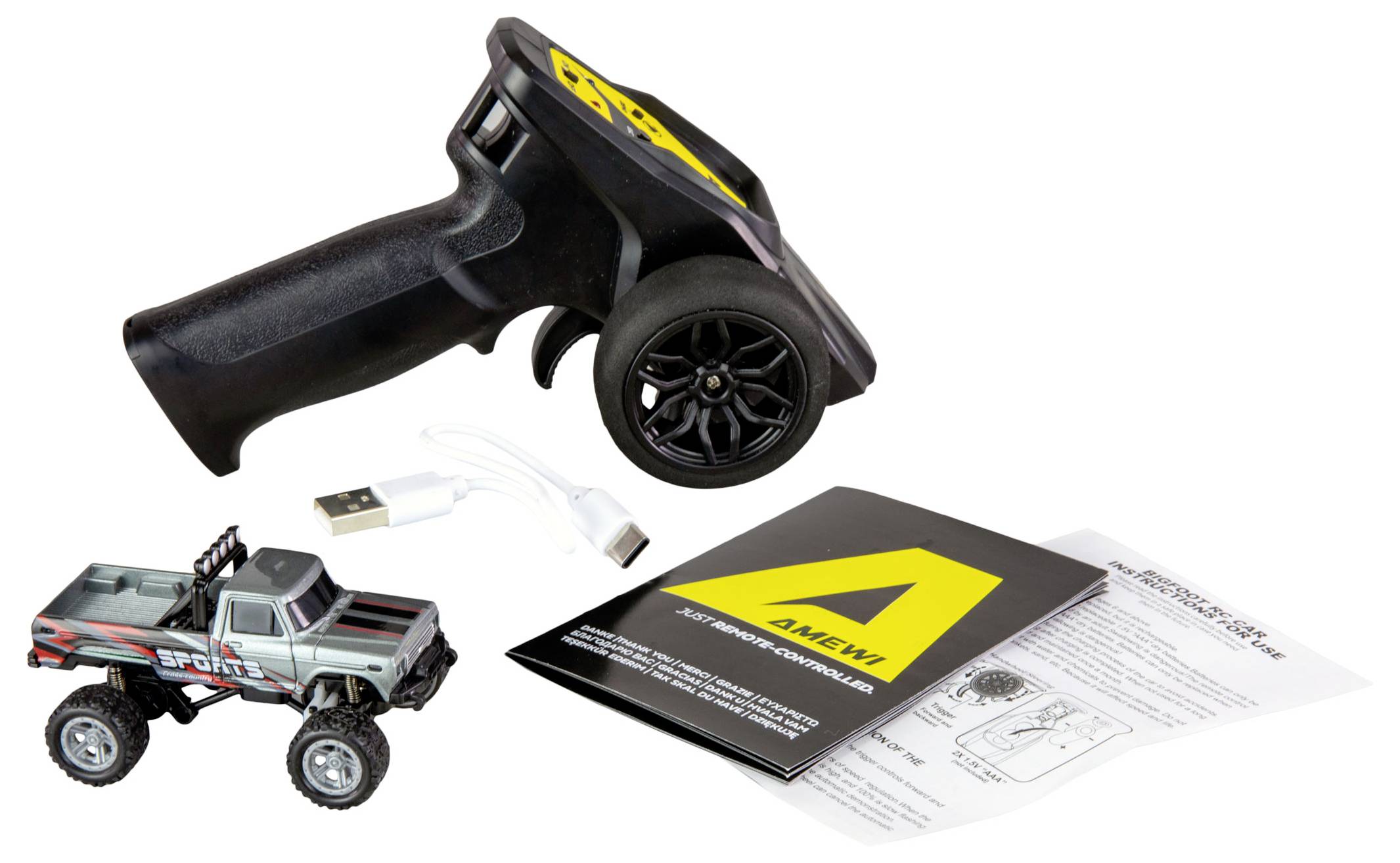 Zdalnie sterowany zestaw samochodowy z kontrolerem, kablem ładującym USB i instrukcją obsługi. Pojazd główny w kolorze szarym z czerwonymi akcentami.