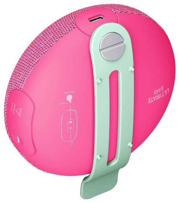 Przenośny, różowy głośnik Bluetooth z zielonym klipsem mocującym i przyciskami sterującymi po bokach. Na górze widoczne jest złącze USB.