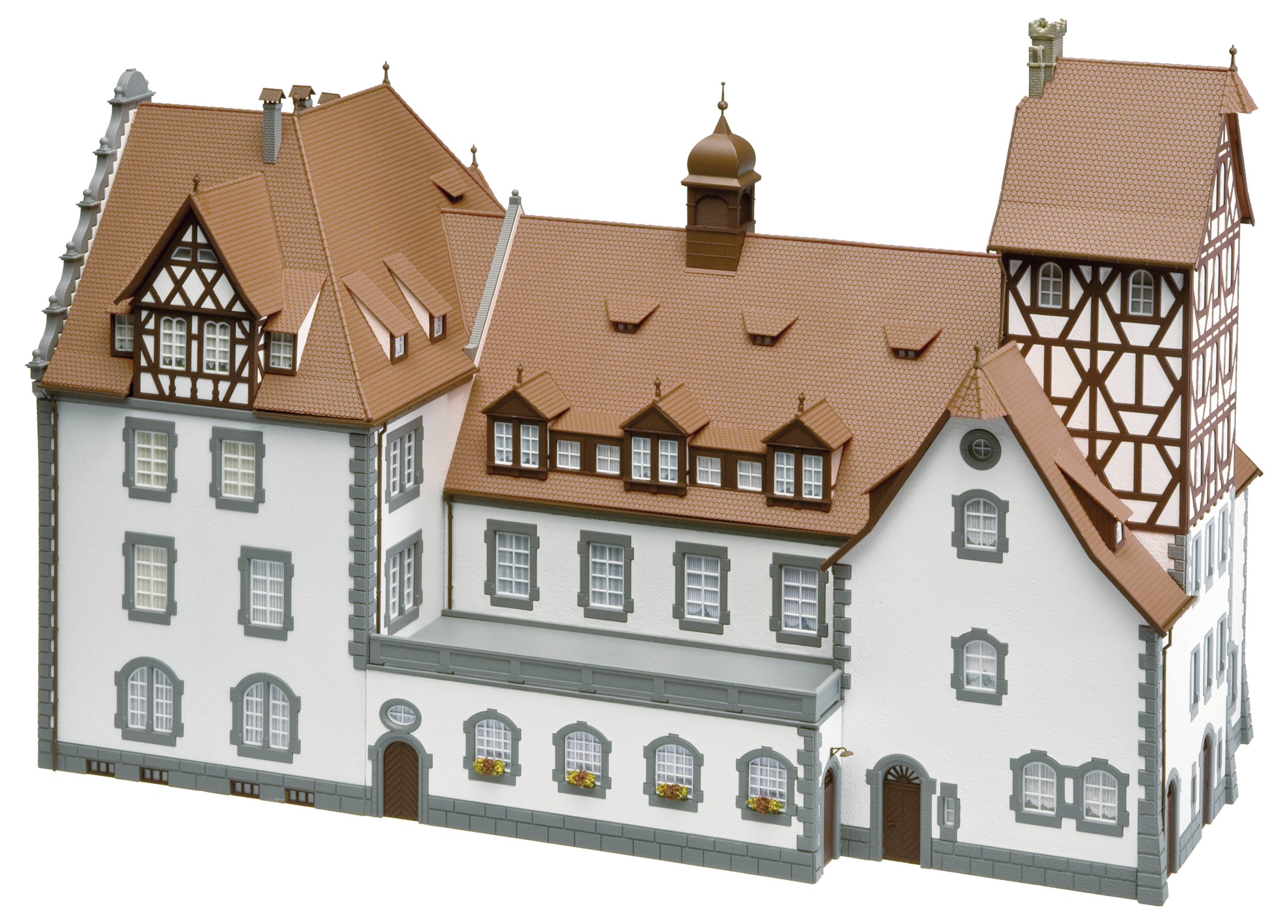 Model historycznego, wielopiętrowego budynku szachulcowego z czerwonymi dachami, ozdobiony małymi oknami i lukarnami.