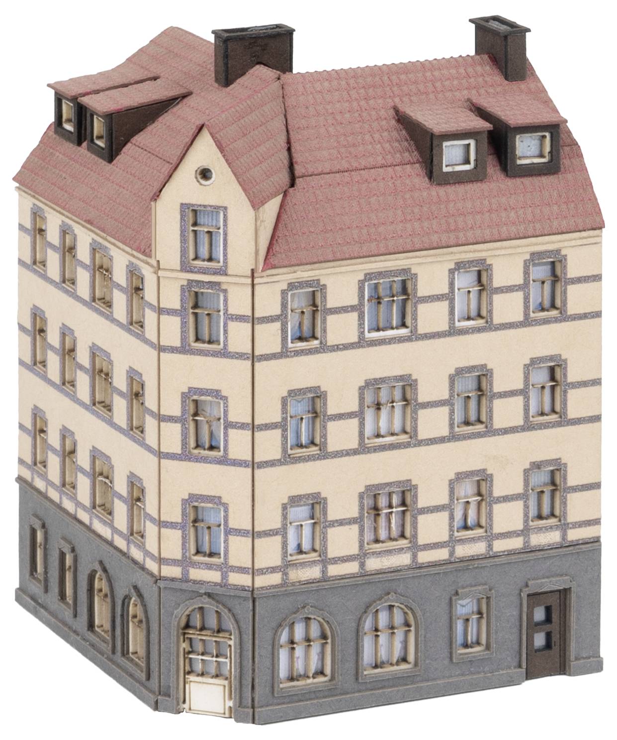 Mały budynek modelowy z czterema piętrami, czerwonym spadzistym dachem i wieloma oknami. Parter posiada sklep z dużymi oknami.