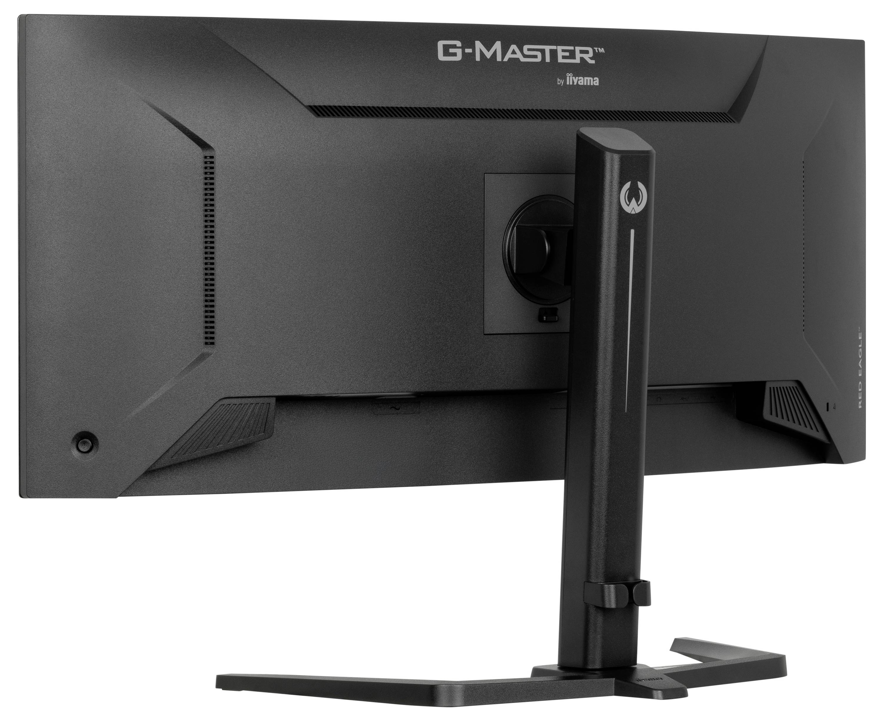 Czarny monitor komputerowy widziany z boku, z szerokim ekranem i solidną podstawą. W tle widoczna jest marka G-Master.