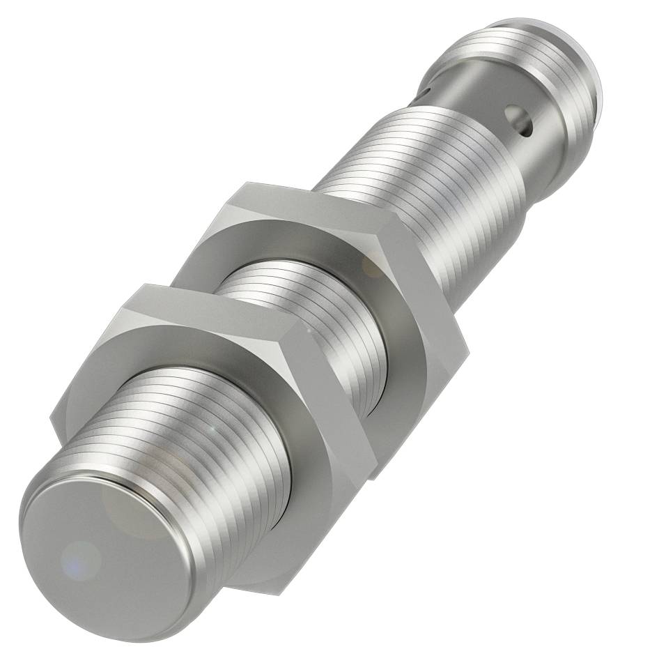Cylindryczny czujnik metalowy z gwintem i dwiema nakrętkami, prawdopodobnie czujnik indukcyjny, leży ukośnie na obrazie.