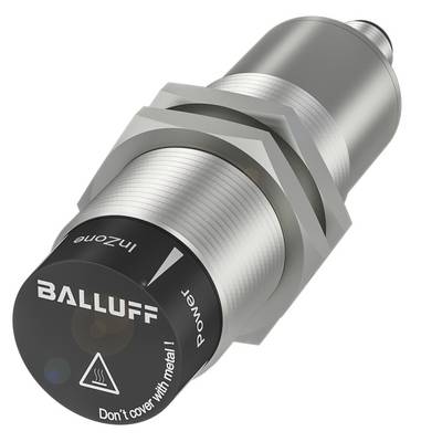 Cylindryczny czujnik indukcyjny firmy Balluff w wykonaniu metalowym z czarną pokrywą przyłączeniową; napis na nim: 'Don't cover with metal'.
