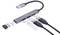 Koncentrator USB z czterema portami: jeden port USB A oznaczony jako '480 Mbps', dwa porty USB A oznaczone jako '5Gbps' oraz jeden port USB A oznaczony jako '10Gbps'.