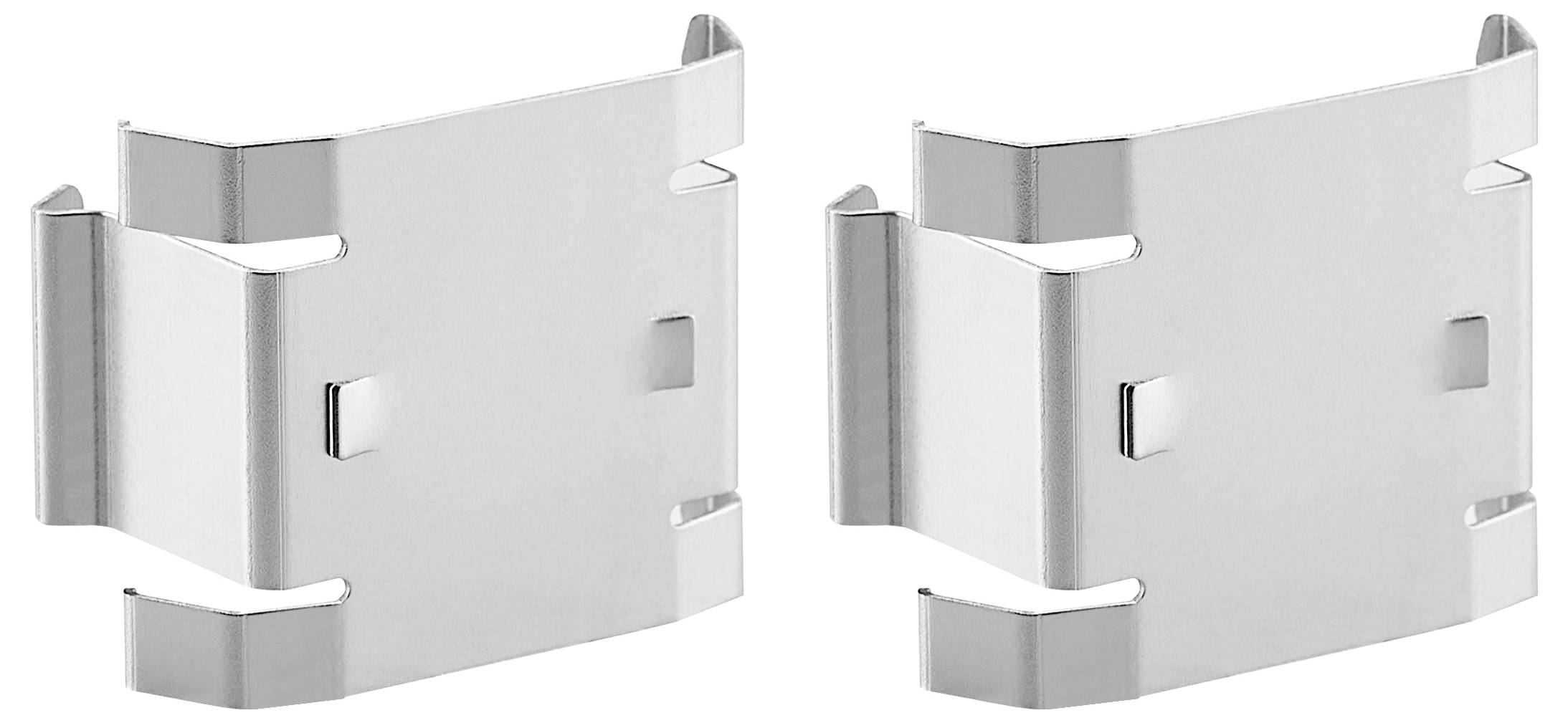 Dwie srebrne metalowe klamerki obok siebie, przeznaczone do mocowania lub podtrzymywania. Mają prostokątny kształt z zaokrąglonymi krawędziami.
