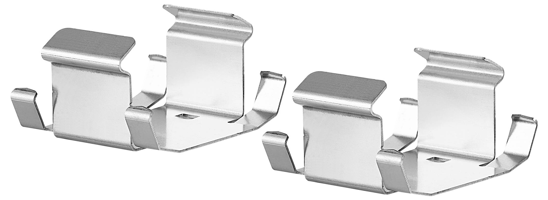 Dwa srebrne metalowe klipsy z zakrzywionymi krawędziami, odpowiednie do mocowania przedmiotów.