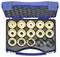Niebieskie plastikowe pudełko zawierające 15 złoconych metalowych wkładek tnących, ułożonych w indywidualnych gniazdach, z wyścieleniem z pianki w pokrywie.