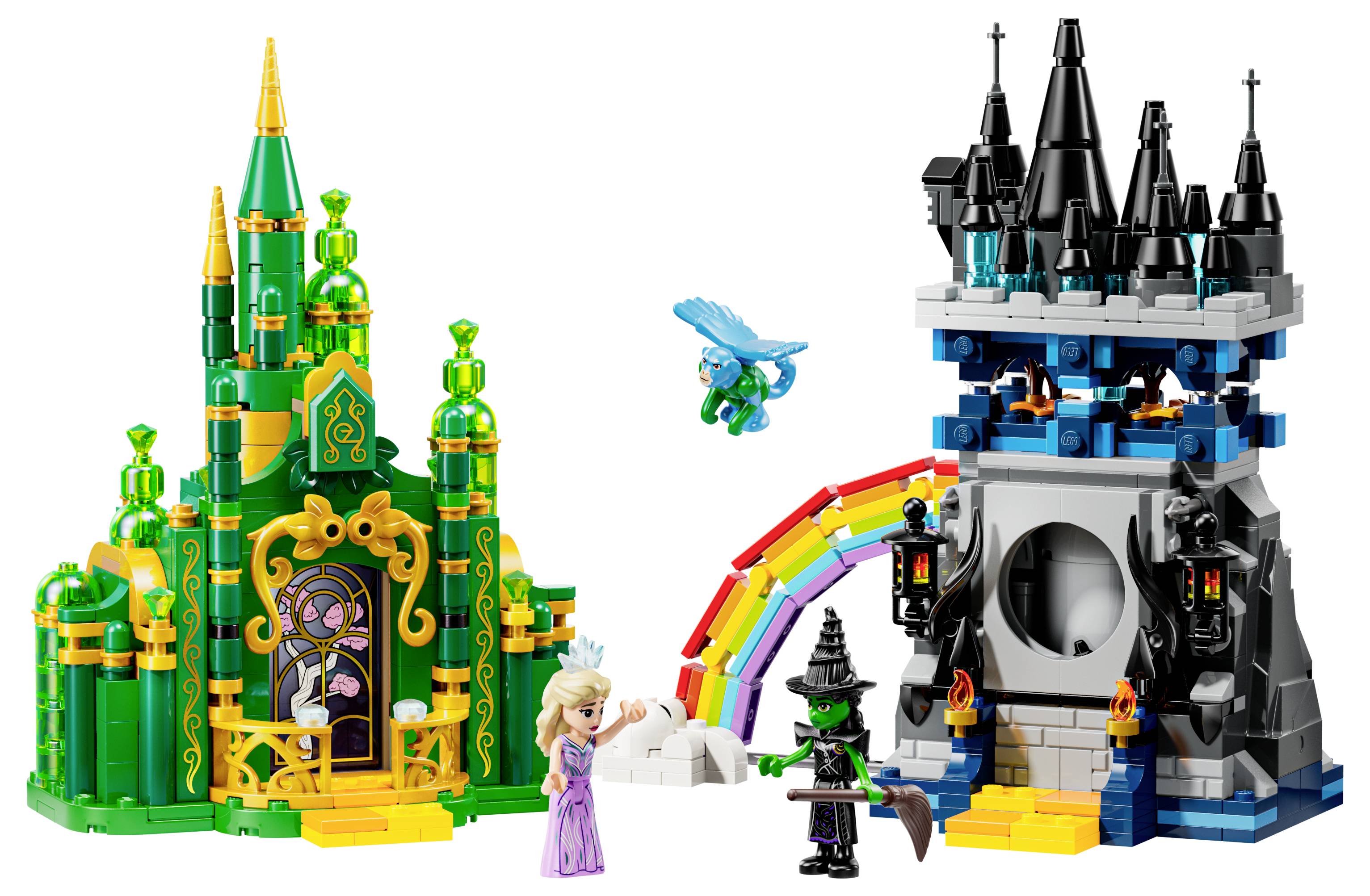 Kolorowa scena fantasy z klocków LEGO z dwoma zamkami; jeden zielony, drugi niebieski. Postacie obejmują wróżkę i czarownicę w pobliżu tęczy.