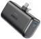 Czarny przenośny powerbank Anker z składaną wtyczką i portem USB-C oznaczonym jako 'In/Out'. Cztery diody LED wskazują poziom naładowania baterii.