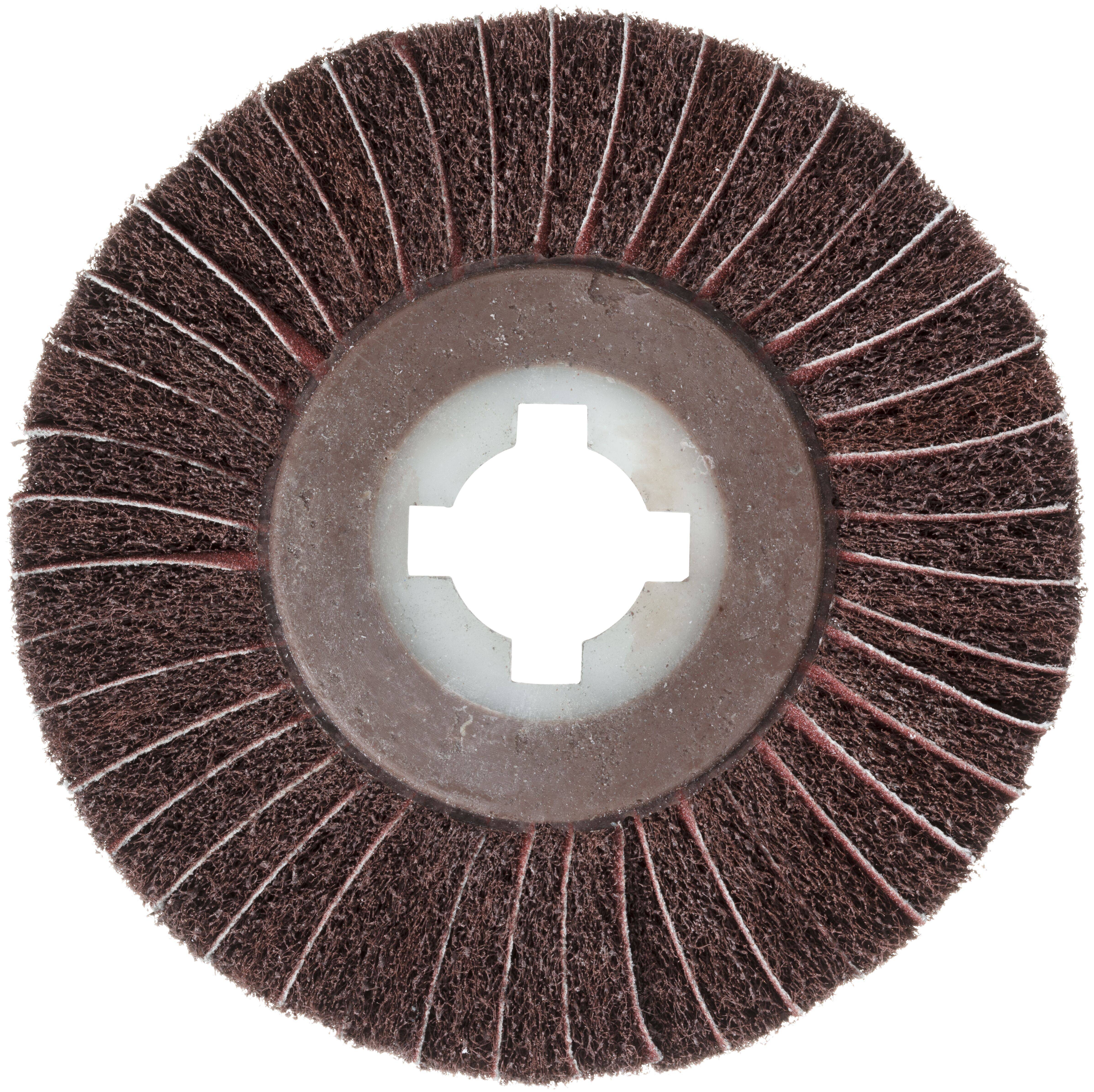 Okrągła szczotka druciana z centralnym otworem, składająca się z licznych promienistych włosków, przeznaczona do czyszczenia lub polerowania powierzchni.