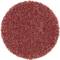 Okrągła, teksturowana, rdzawobrązowa powierzchnia, przypominająca krążek papieru ściernego, używana do szlifowania lub polerowania materiałów.