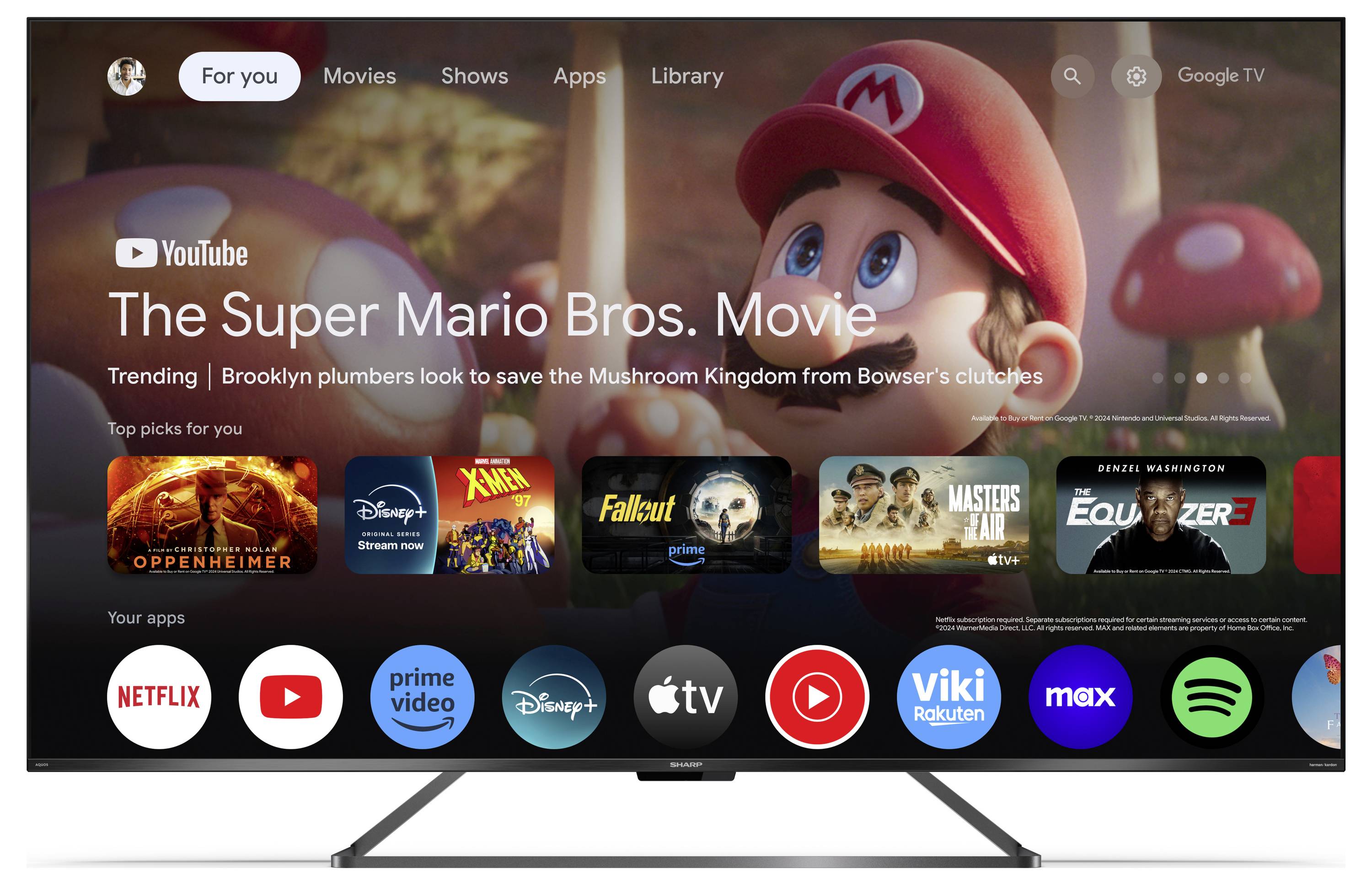 Interfejs telewizora Smart TV wyświetla film "Super Mario Bros.: Film" dostępny na YouTube, obok różnych ikon aplikacji, w tym Netflix i Disney+.