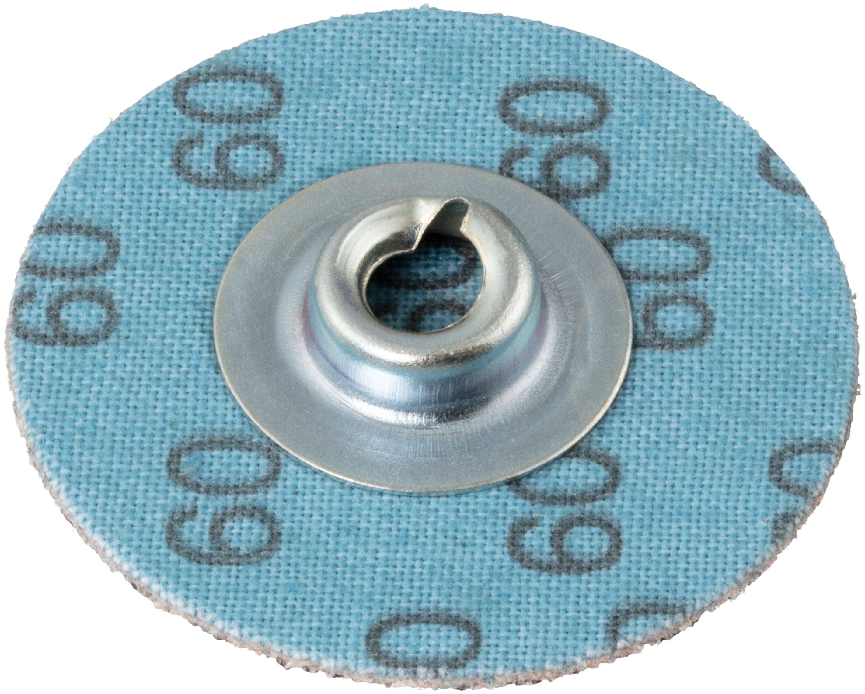 Okrągła tarcza ścierna z numerem '60' widocznym na niebieskiej powierzchni, oznaczającym ziarnistość; centralne mocowanie metalowe.