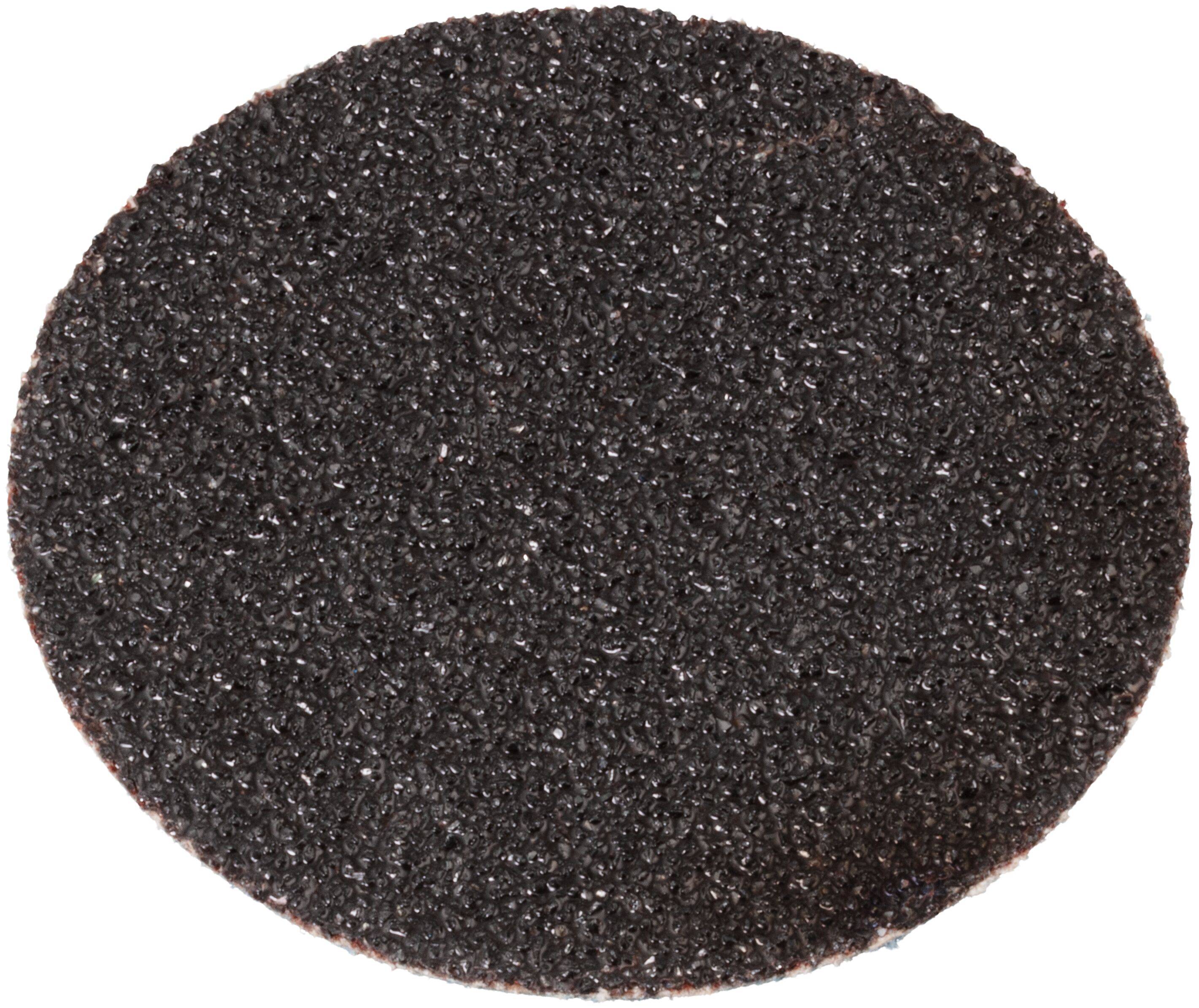 Okrągła, teksturowana, czarna tarcza ścierna używana do szlifowania i wykańczania powierzchni, odizolowana na białym tle.
