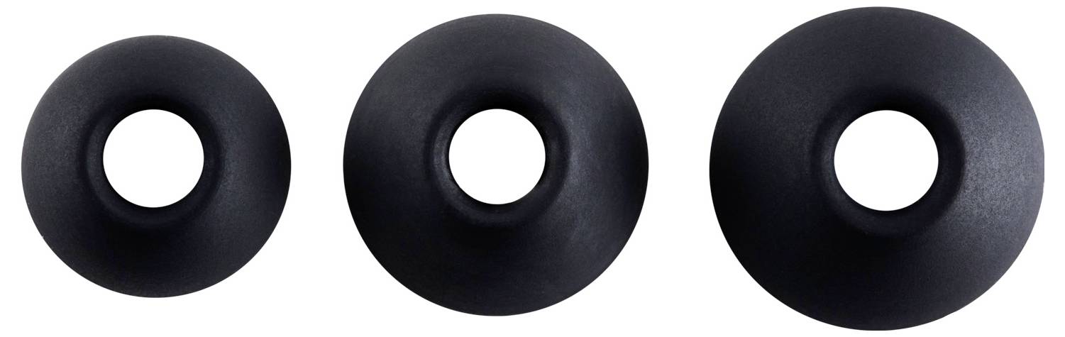 Trzy czarne obiekty o kształcie kół z pustymi środkami, ułożone w kolejności rosnącej wielkości od lewej do prawej na białym tle.
