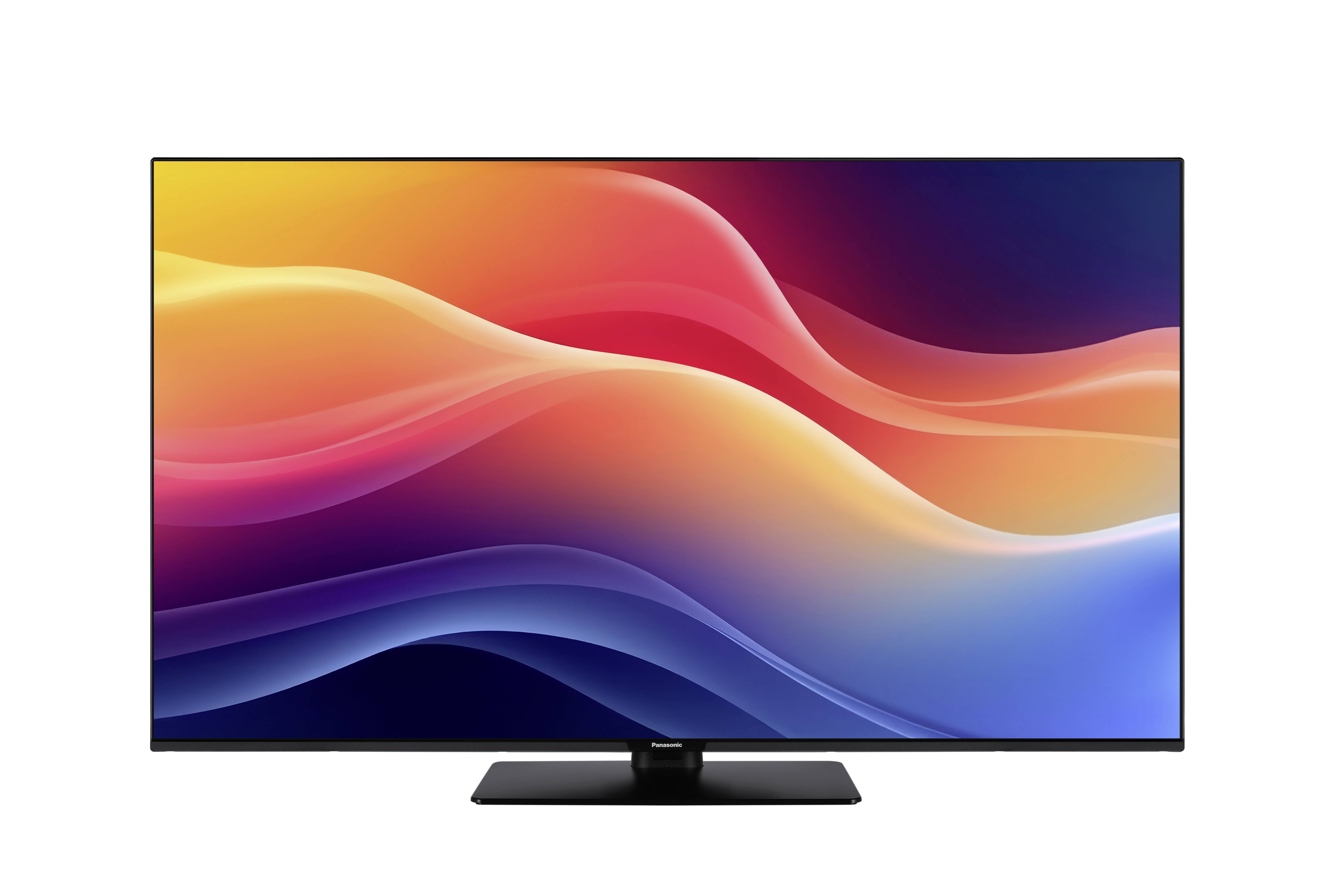 Płaski telewizor widziany od tyłu, ukazujący jego podstawę i porty przyłączeniowe.