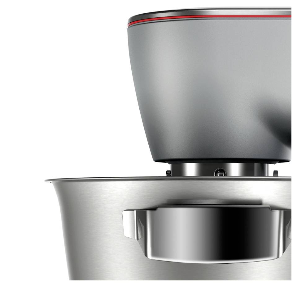 Zbliżenie metalowego urządzenia kuchennego, prawdopodobnie miksera, podkreślające jego elegancki stalowy design i nowoczesne funkcje.