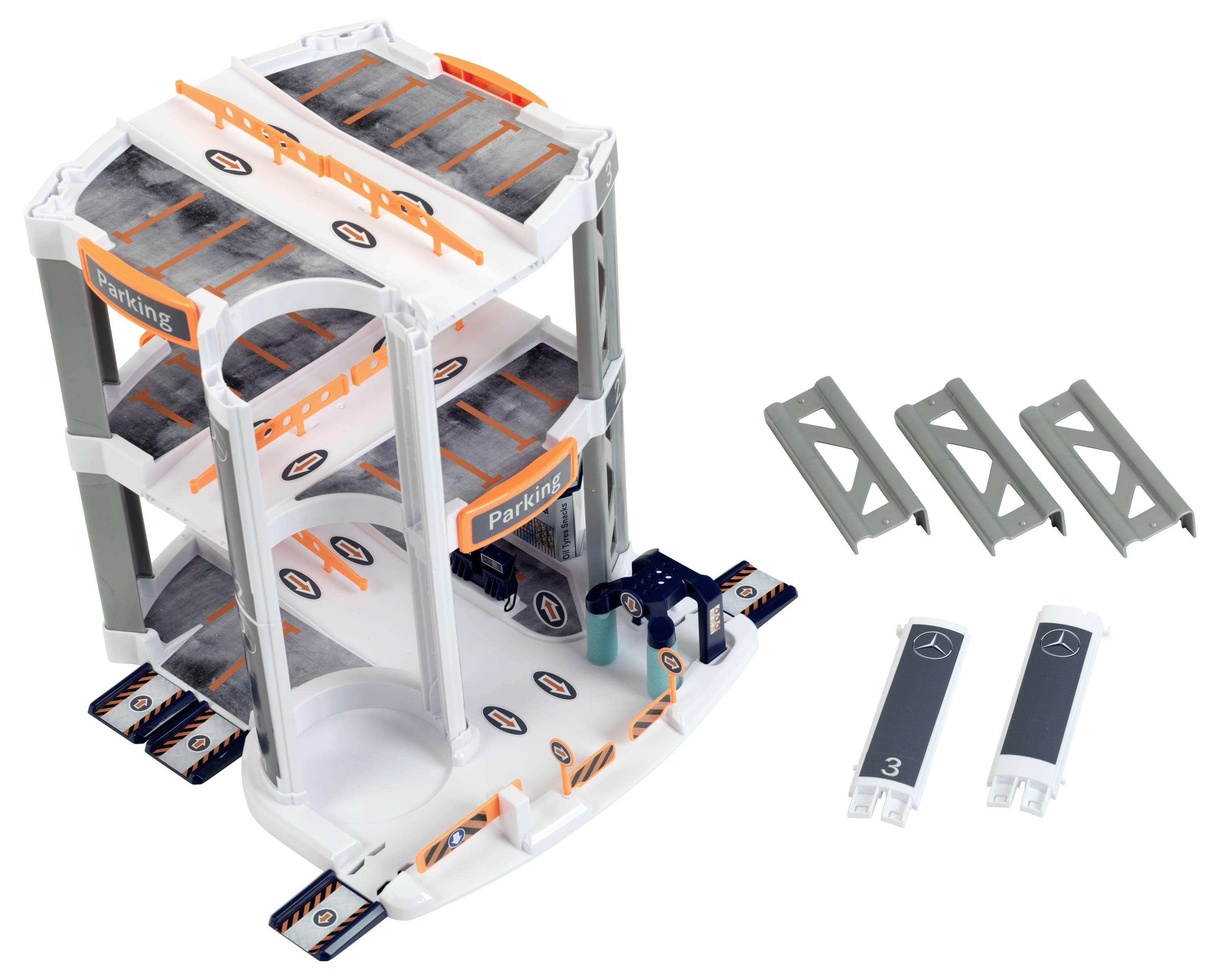 Zabawkowy parking wielopoziomowy z trzema kondygnacjami, zjazdami i barierkami. Zawiera oznaczenia miejsc parkingowych i tabliczki z napisem 'Parking', a także dodatkowe elementy wyposażenia obok niego.