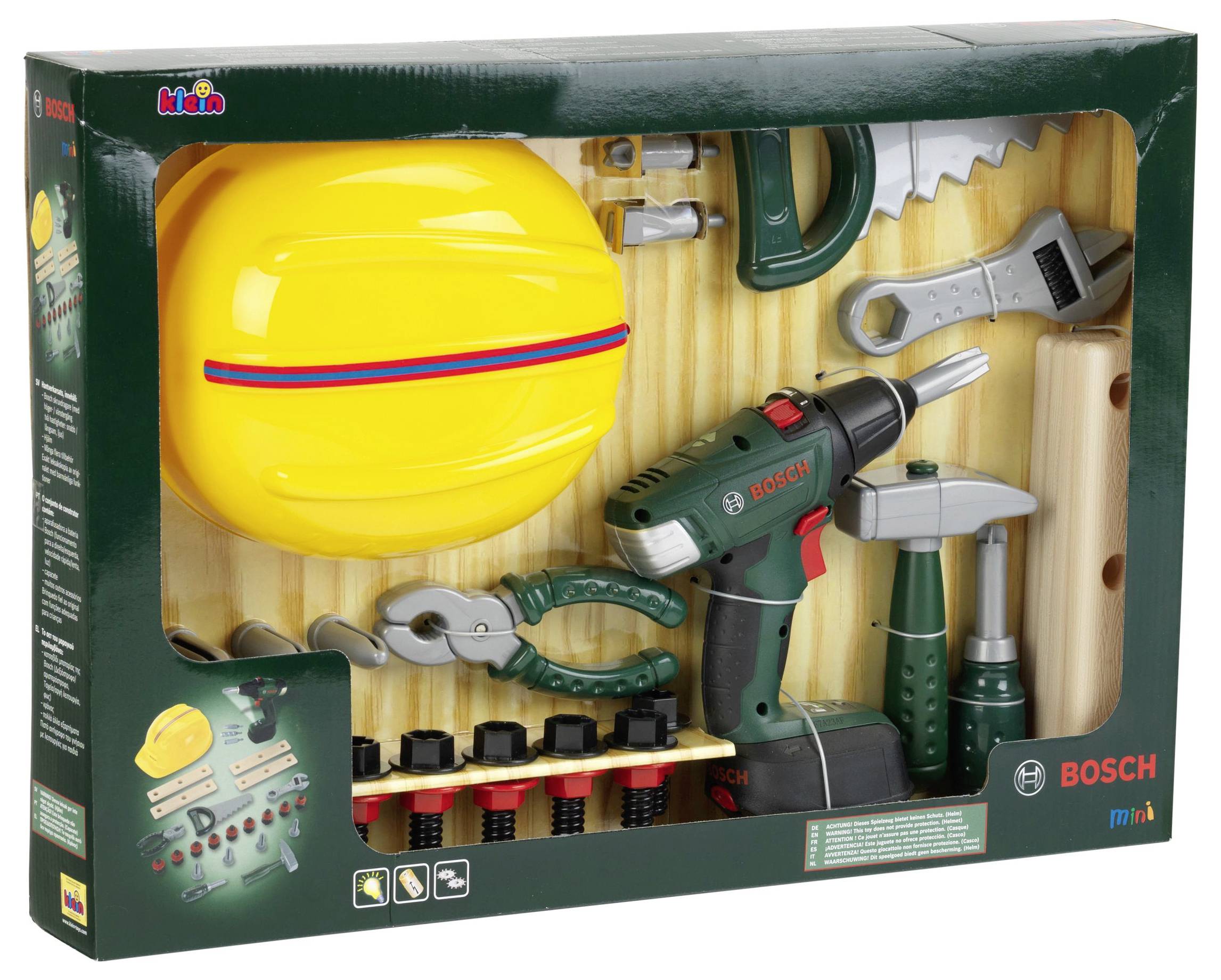 Zestaw narzędzi dla dzieci obejmuje żółty kask, zieloną wiertarkę, szczypce, piłę, młotek oraz śruby umieszczone na tekturowym tle w pudełku wystawowym.