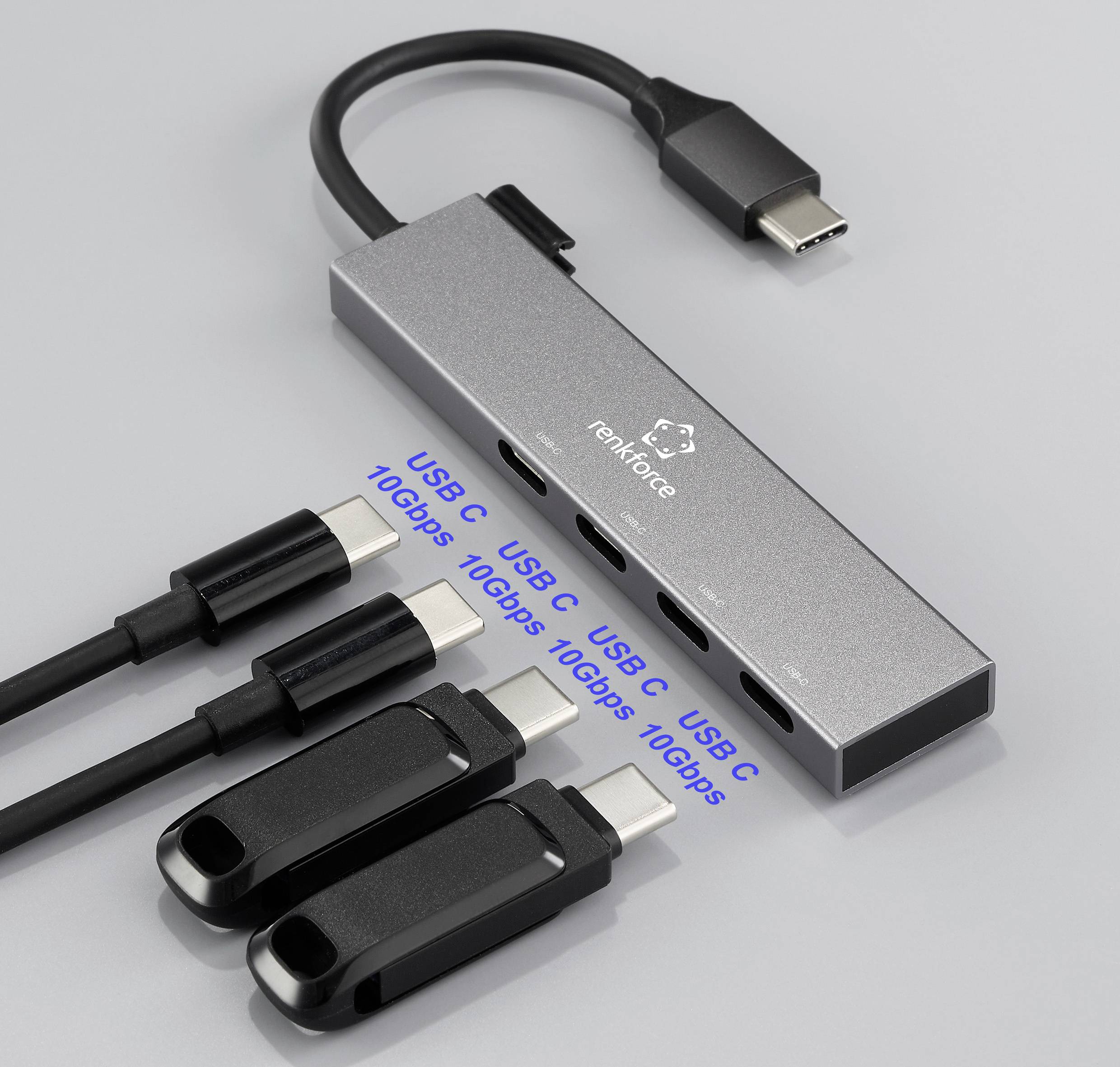 Koncentrator USB-C jest podłączony do wielu urządzeń, w tym dwóch kabli USB-C i dwóch wtyczek USB-A. Obsługuje prędkości transferu danych do 10 Gb/s.