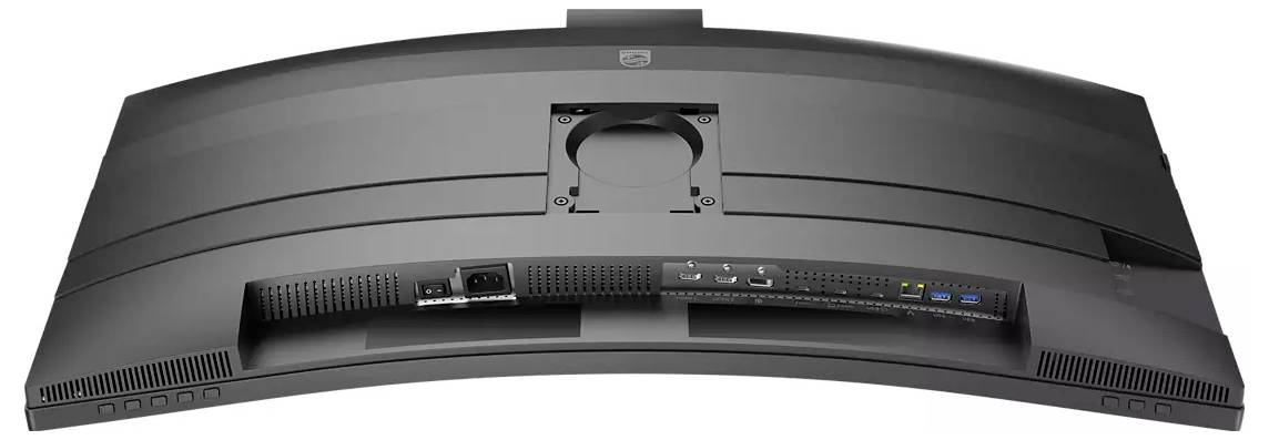 Widok z tyłu zakrzywionego monitora komputerowego, prezentujący różne porty i płytę montażową.