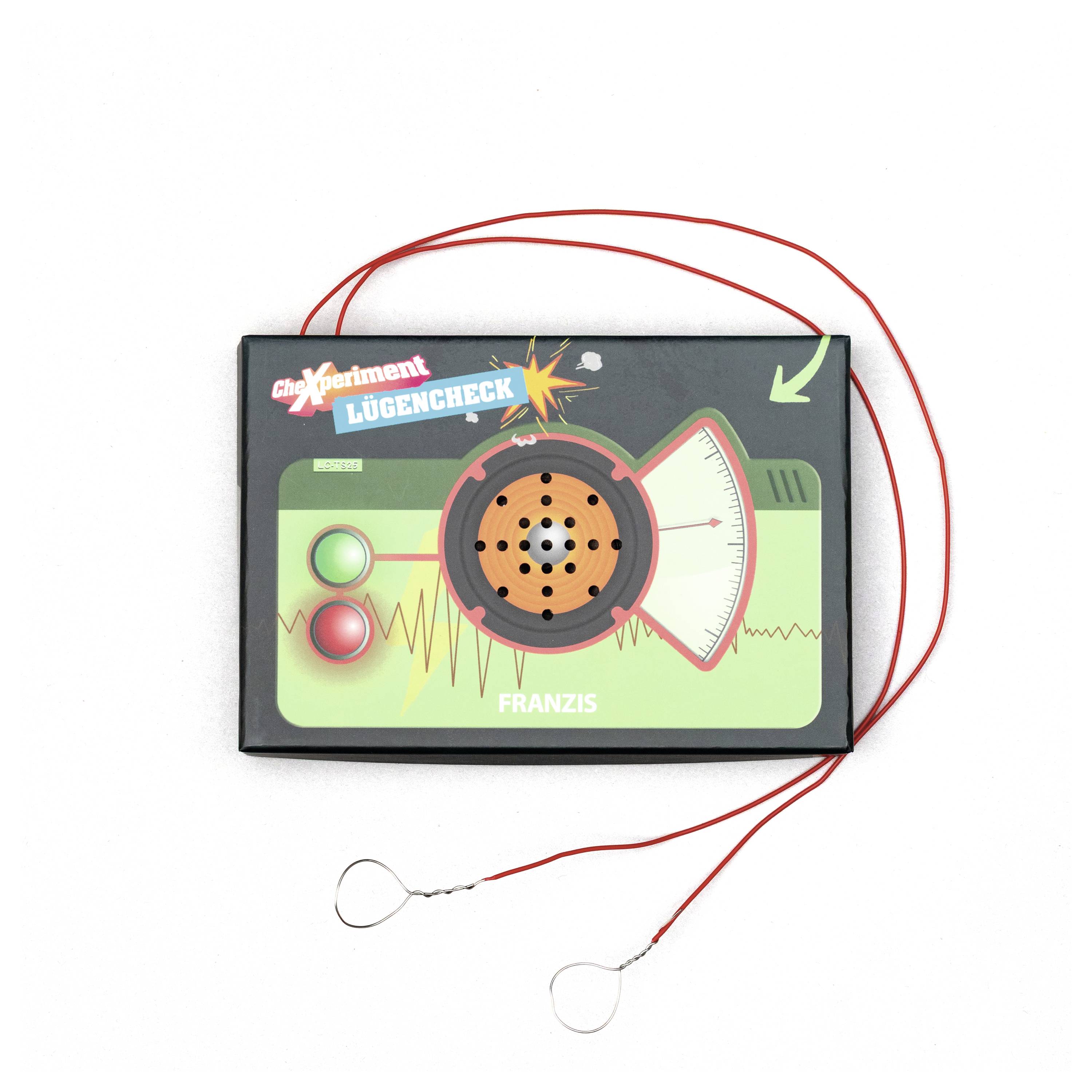 Zabawka - detektor kłamstw z czerwonymi przewodami, wskaźnikiem igłowym oraz czerwonym i zielonym przyciskiem, oznaczona jako 'Lügencheck' i 'Franzis'.
