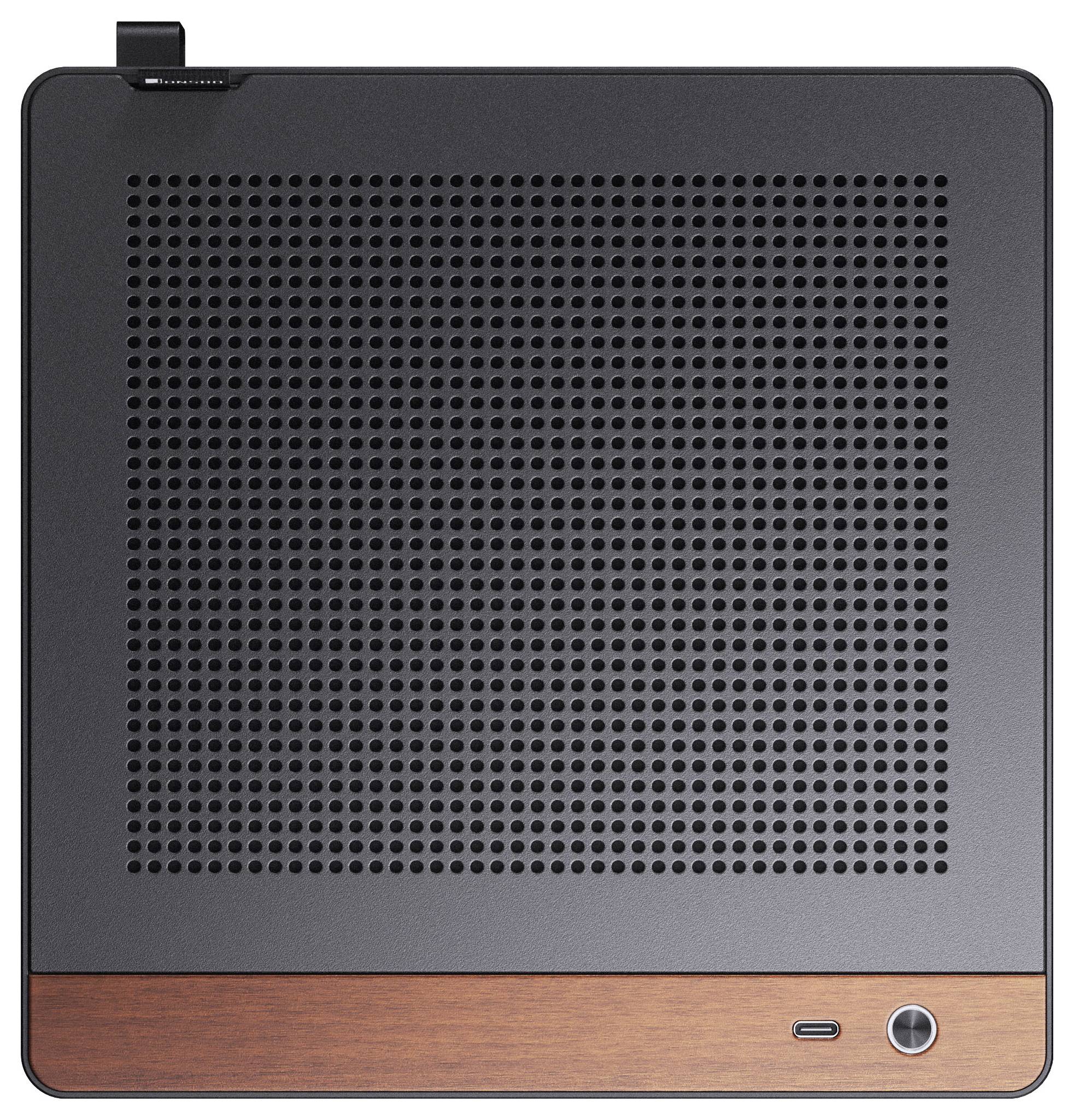 Kwadratowe urządzenie elektroniczne z dziurkowaną czarną powierzchnią i drewnianą ramką przy dolnej krawędzi, wyposażone w jeden przycisk.