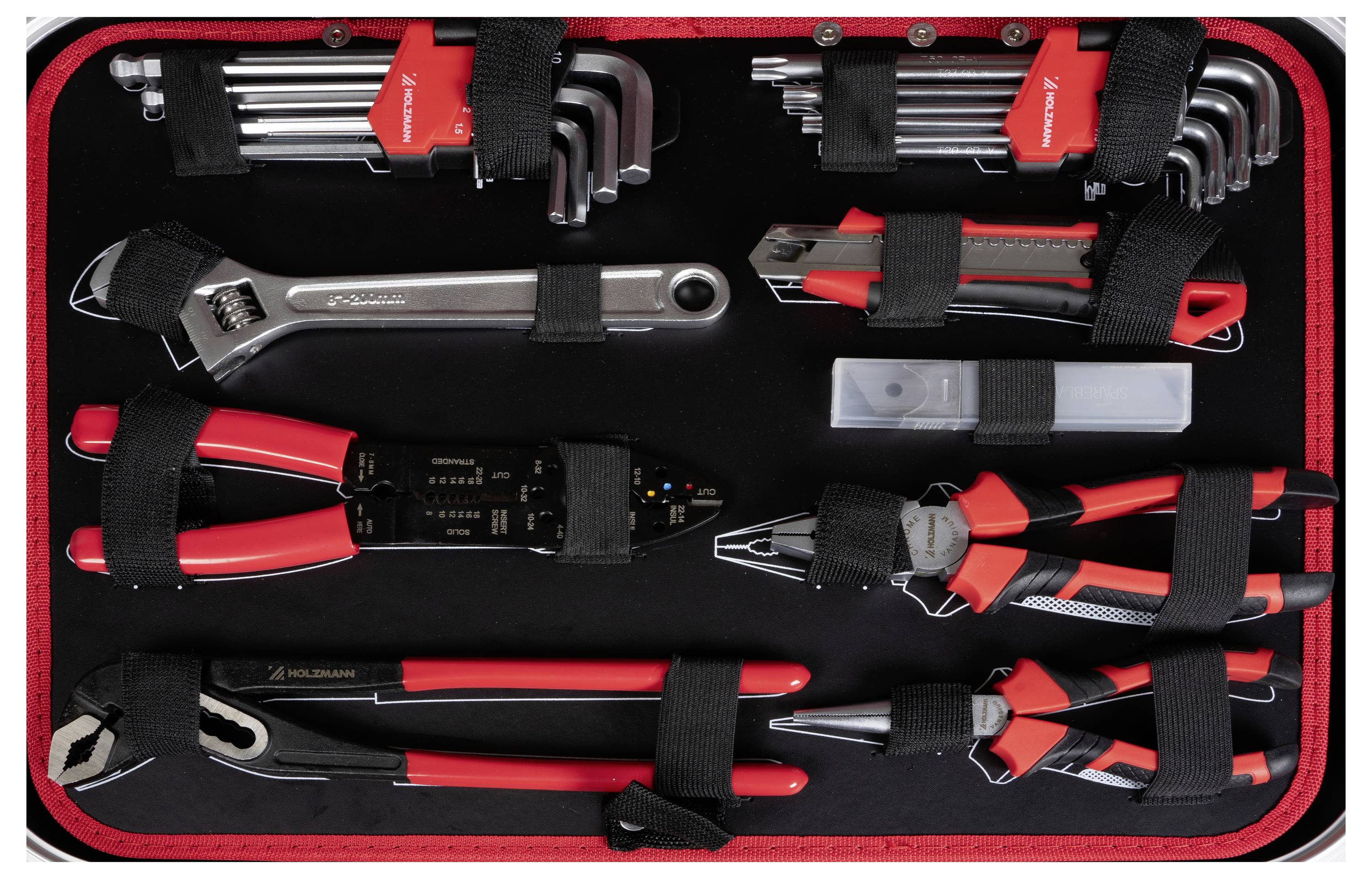 Zestaw różnych narzędzi ułożonych starannie na czarno-czerwonej tacy, w tym klucze, wkrętaki i szczypce zabezpieczone czarnymi paskami.