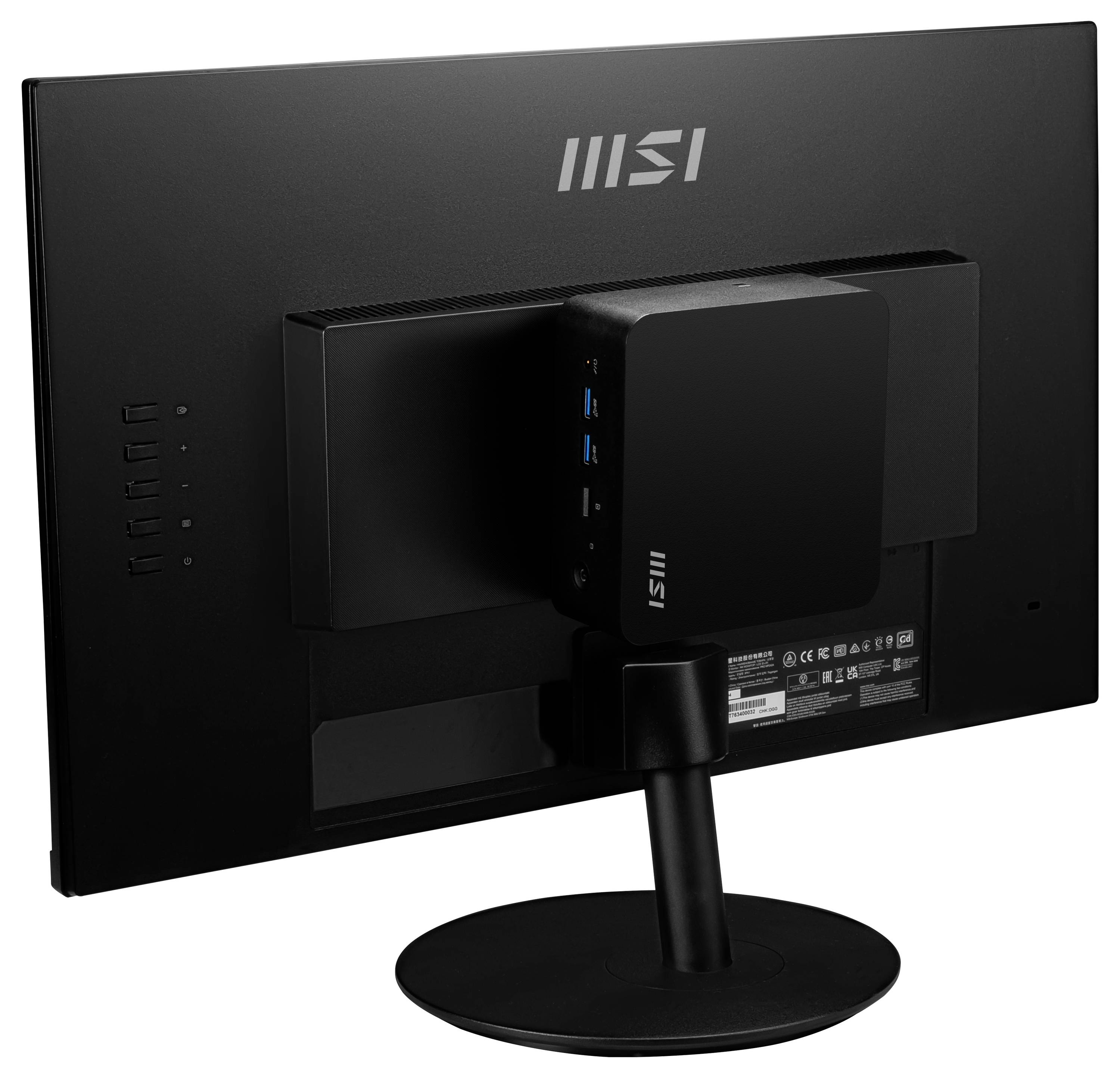 Obraz przedstawia widok z tyłu czarnego monitora komputerowego MSI z prostokątnym urządzeniem przymocowanym do jego podstawy.