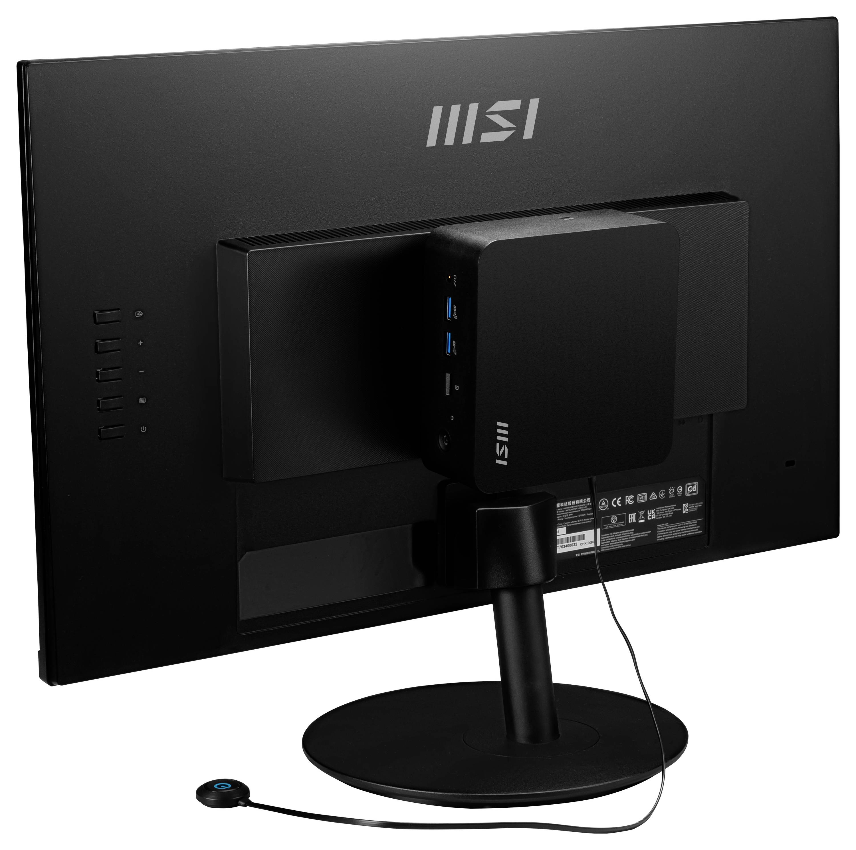 Komputer stacjonarny z eleganckim, czarnym monitorem firmy MSI, ujawniający minimalistyczny tylny design i porty połączeniowe z tyłu.