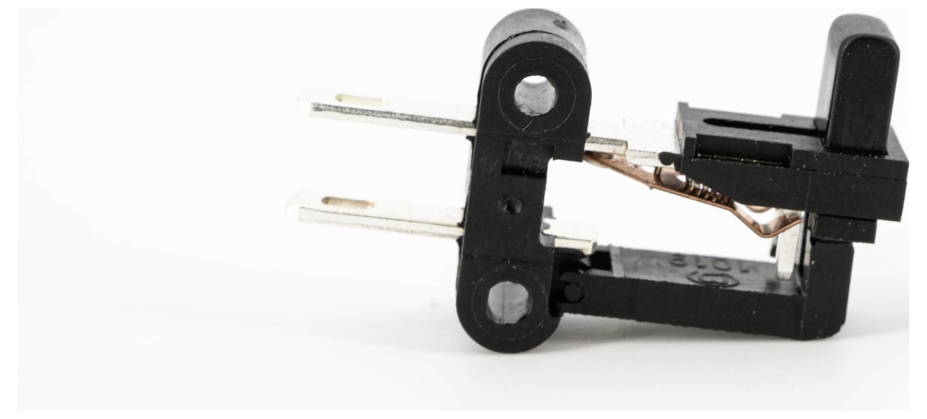 Czarny mikrowyłącznik z metalowymi zaciskami, stosowany w urządzeniach elektronicznych do wykrywania zmian położenia fizycznego.