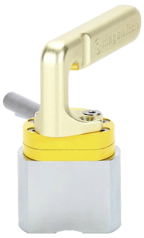 Metalowe urządzenie z pozłacaną rączką, żółtą sekcją środkową i srebrną podstawą; prawdopodobnie magnetyczne narzędzie lub uchwyt przełącznika.
